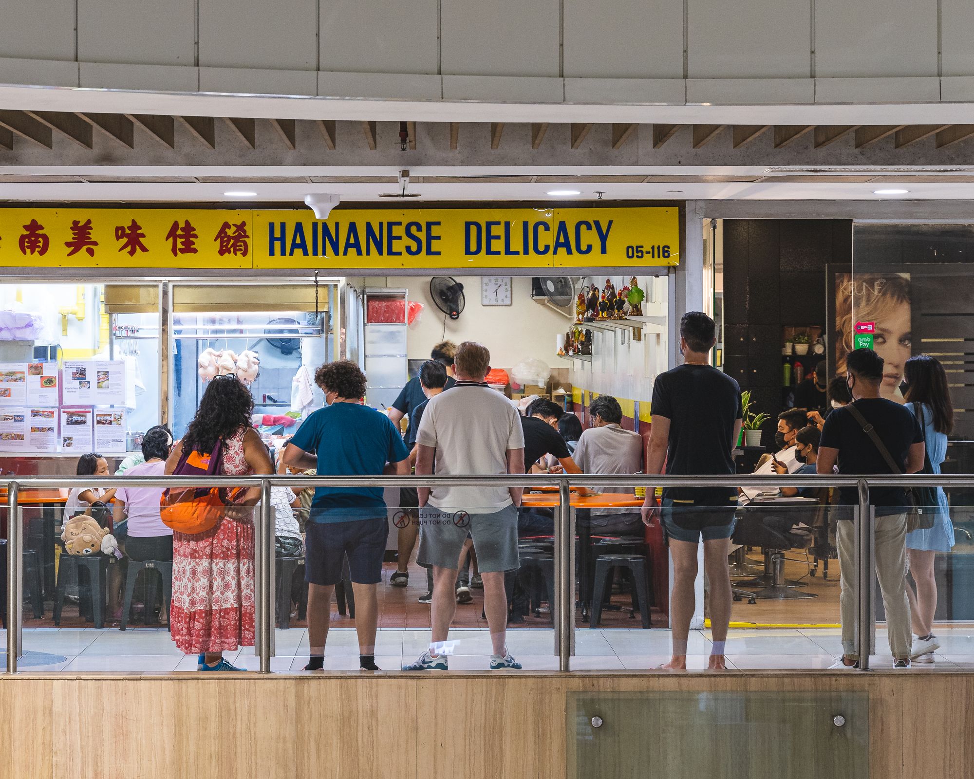 Wide shot of guests lining up to go inside a restaurant