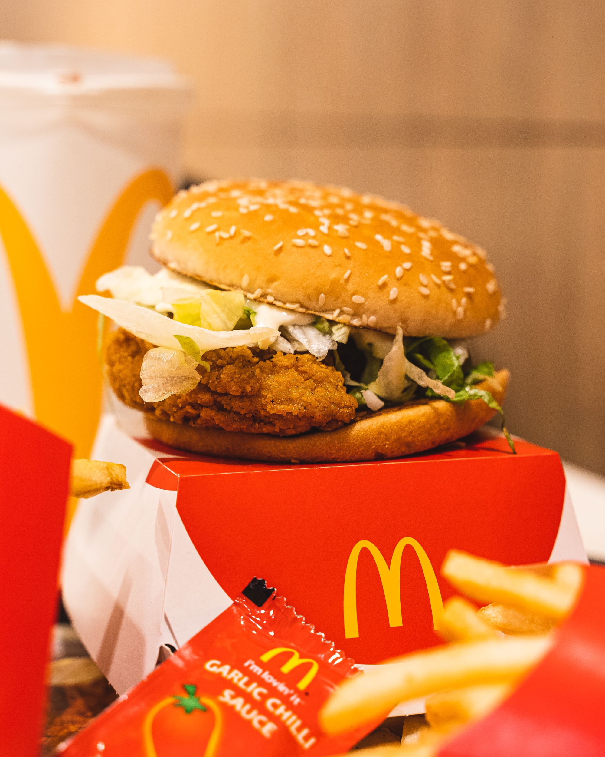 McDonalds' McSpicy burger placed no-top of a McDonalds box