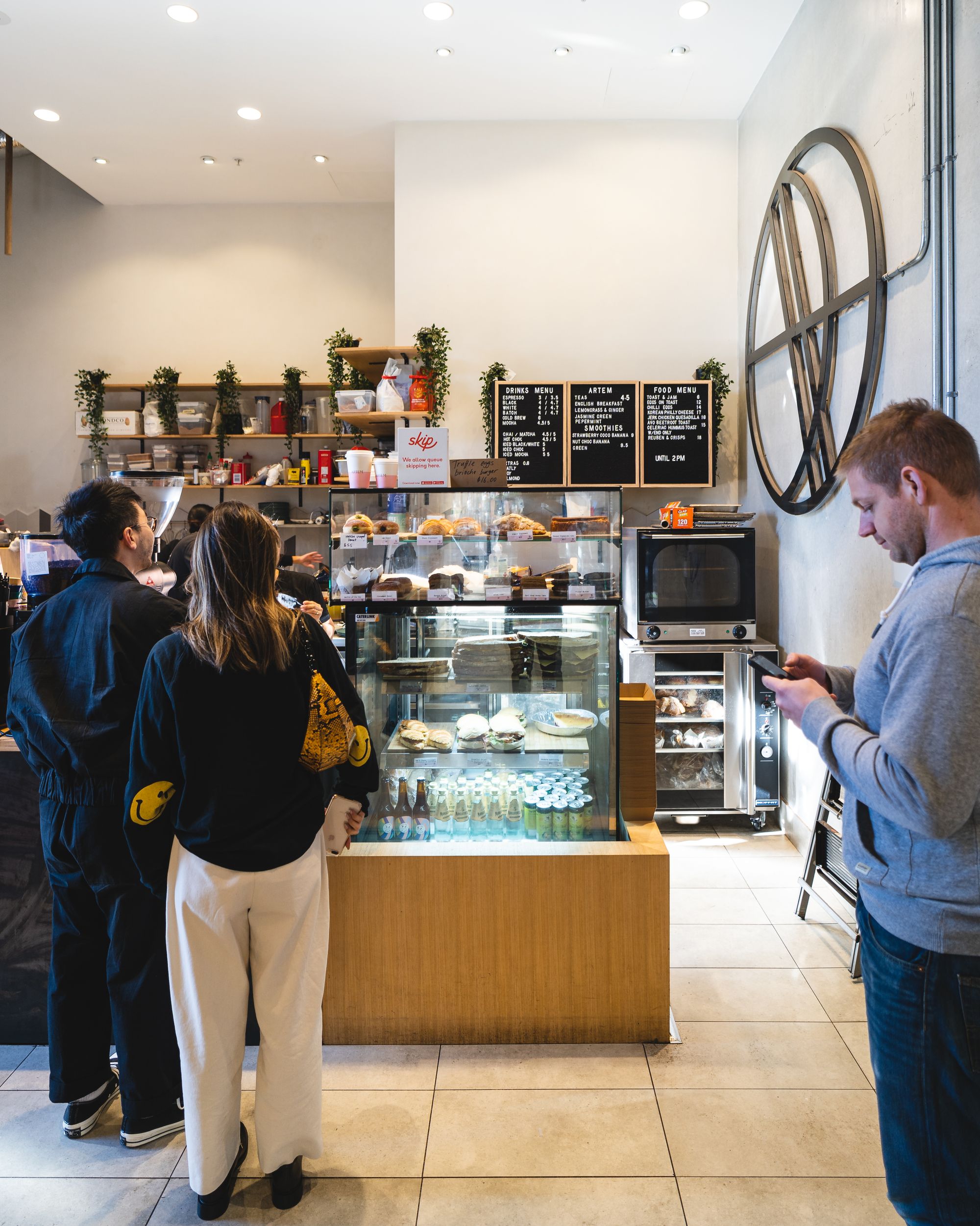 Interior shot of Artem showing people lining up to order