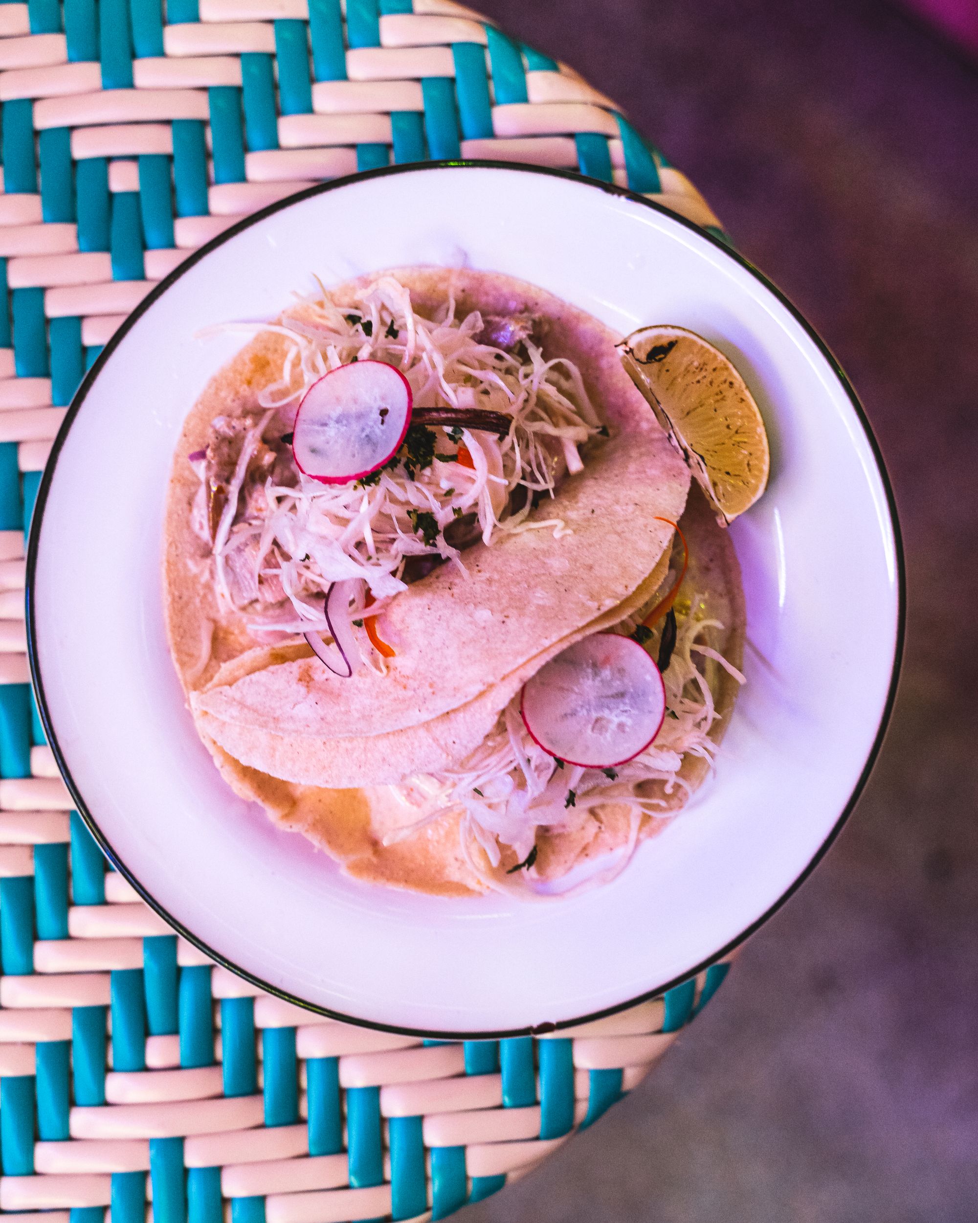 Overhead shot of tacos in a round bowl