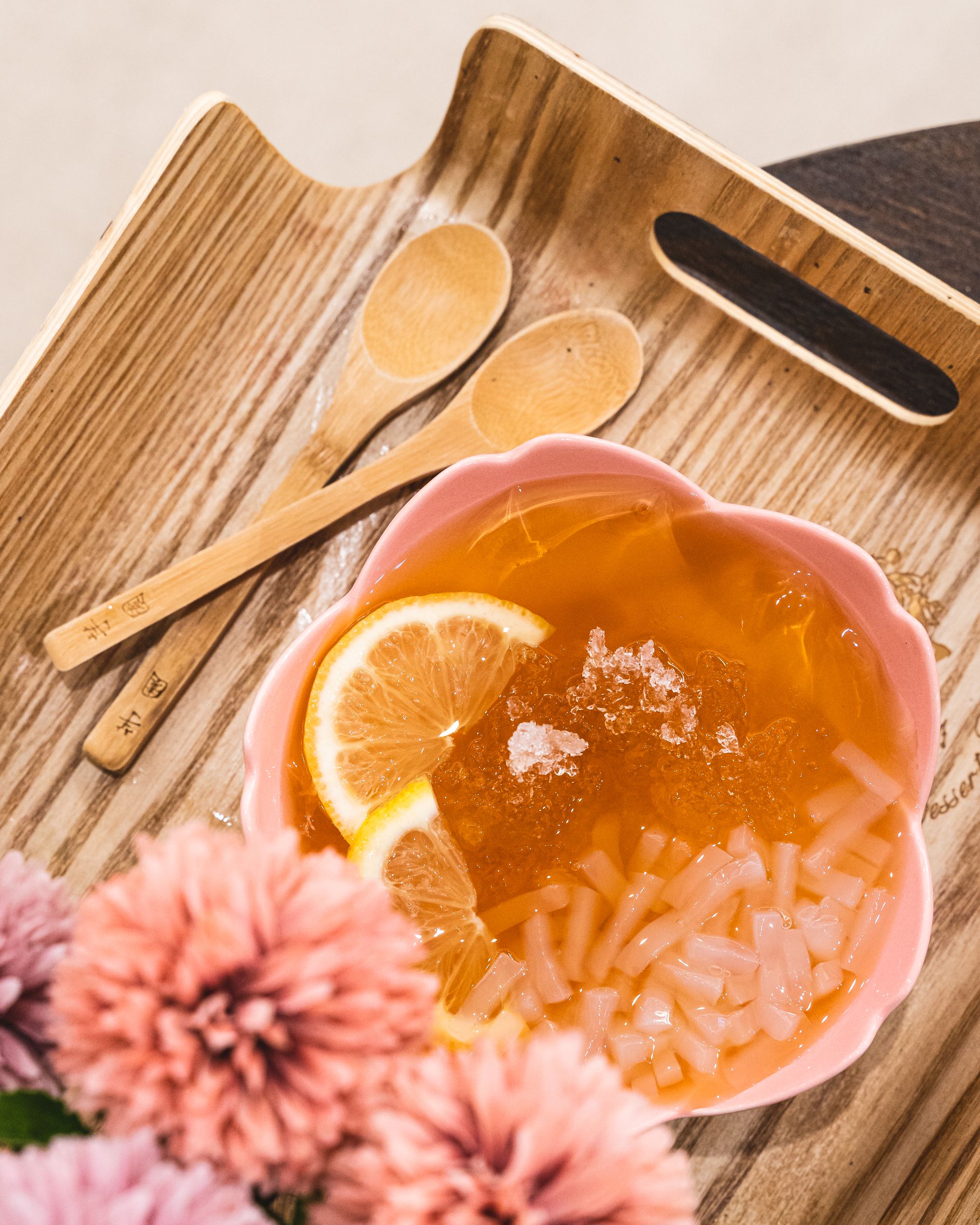 Overhead shot of jelly dessert on a tray in a flower shaped bowl