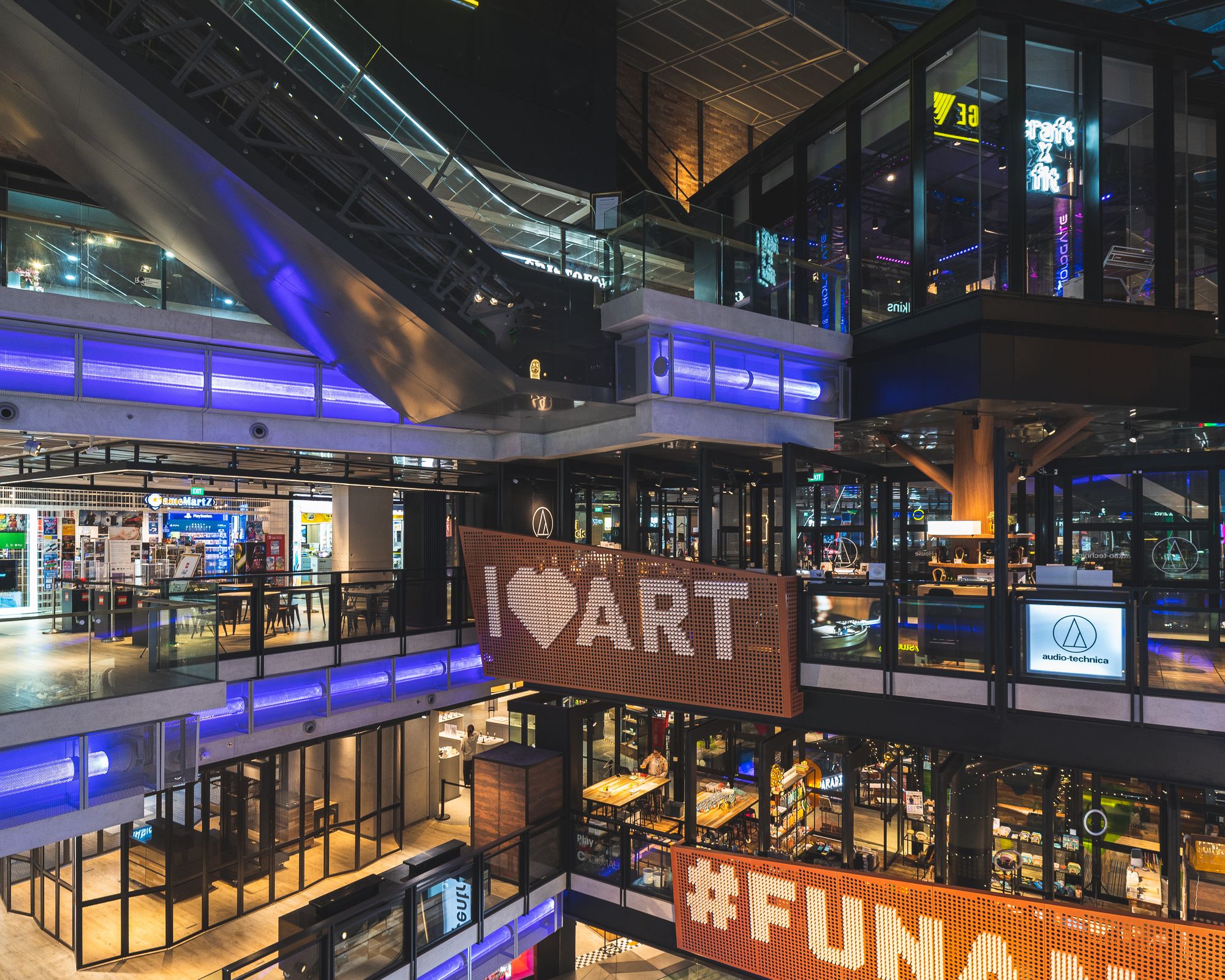 Interior of Funan mall, showing a number of floors and the indoor climbing all