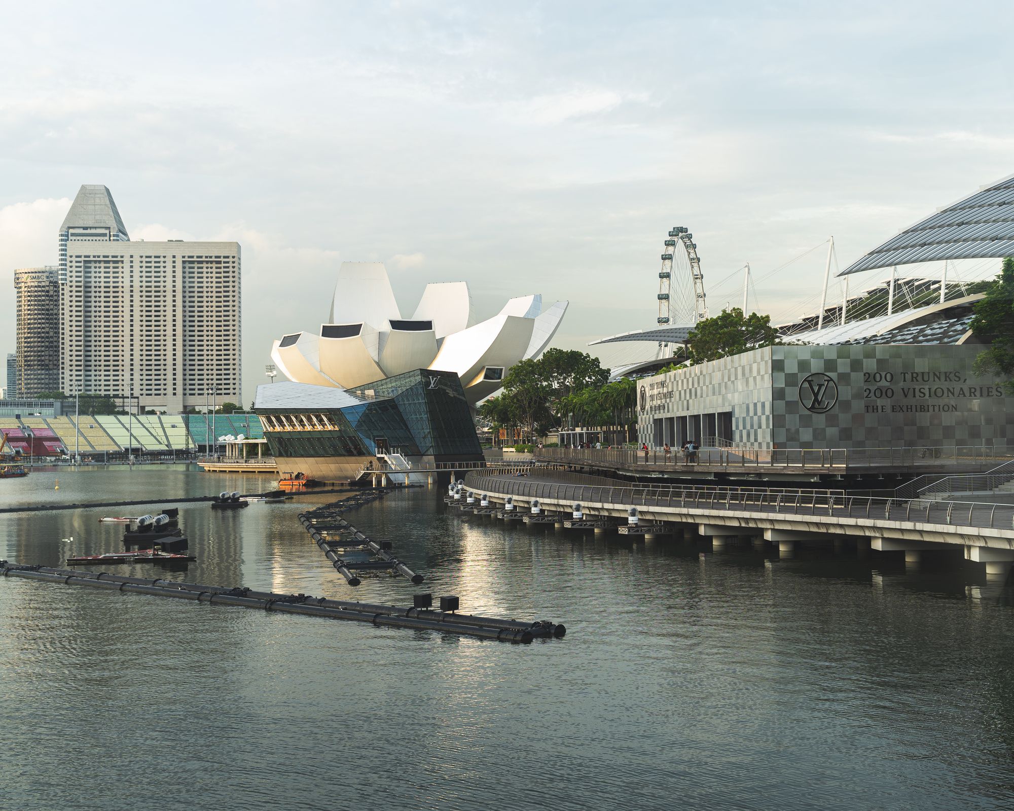 Wide shot showing Singapore's ArtScience museum and the Singapore Flyer in the background