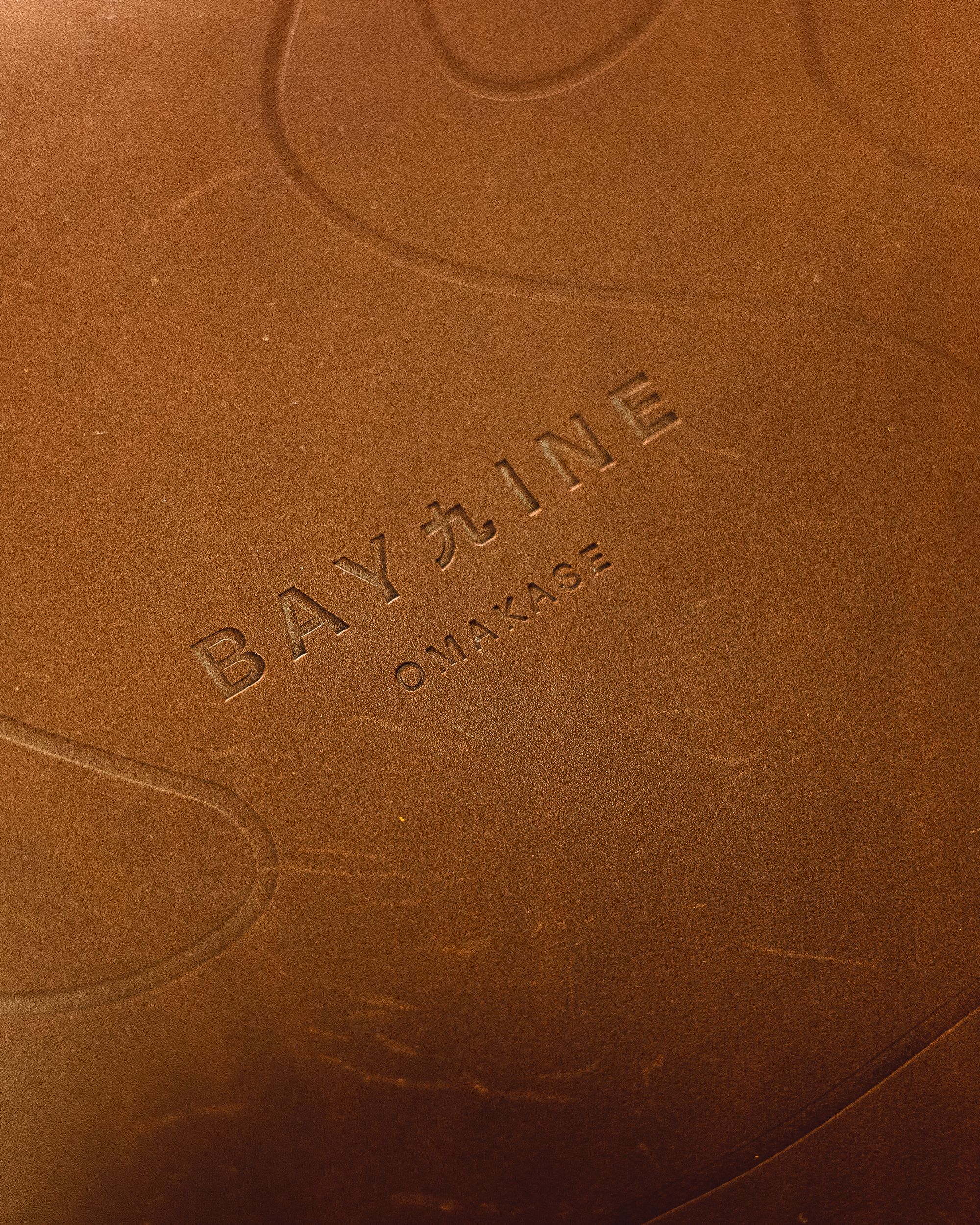 Close up of Bay Nine's leather menu cover