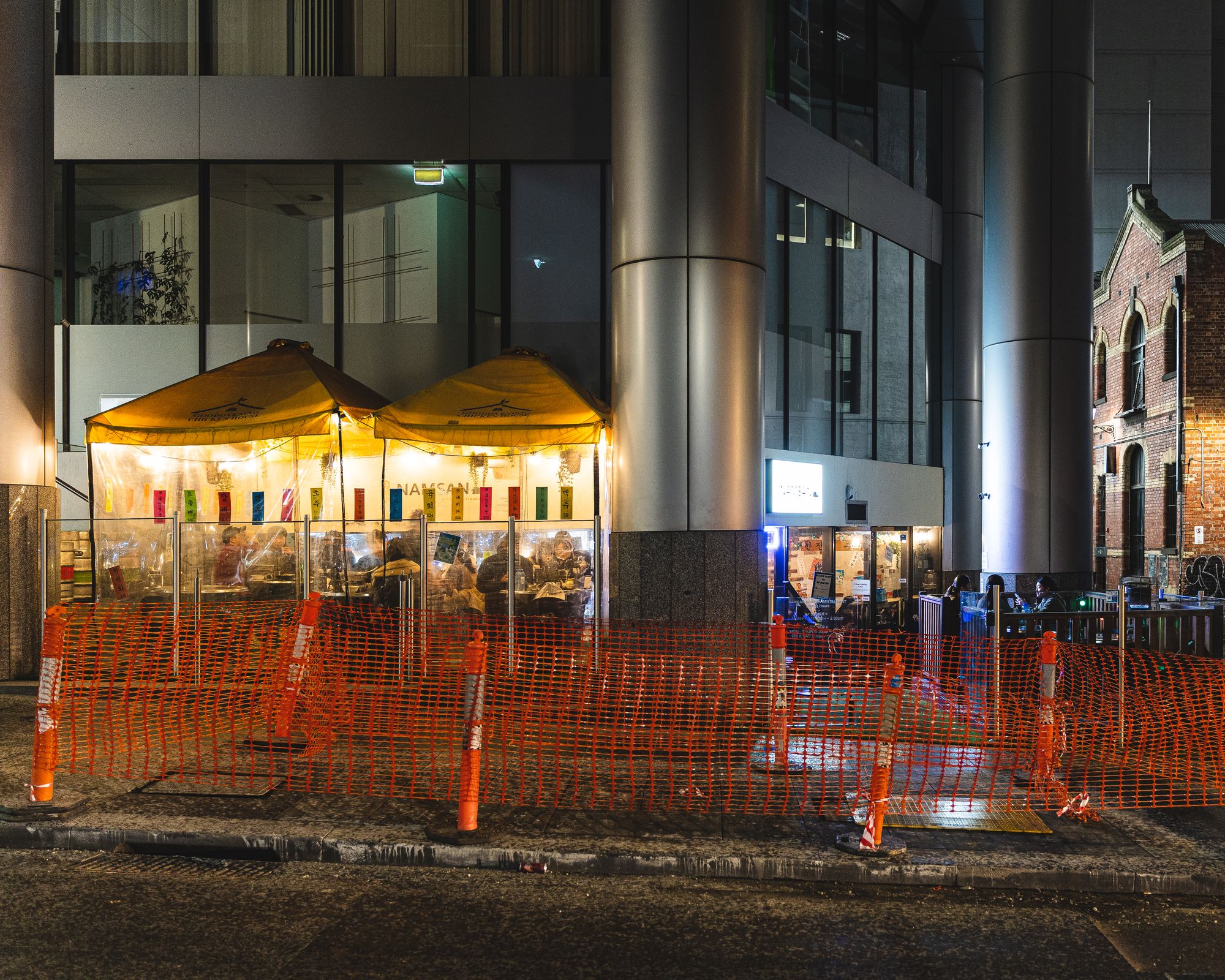 Exterior photo of Namsan showing makeshift tents that guests dine in