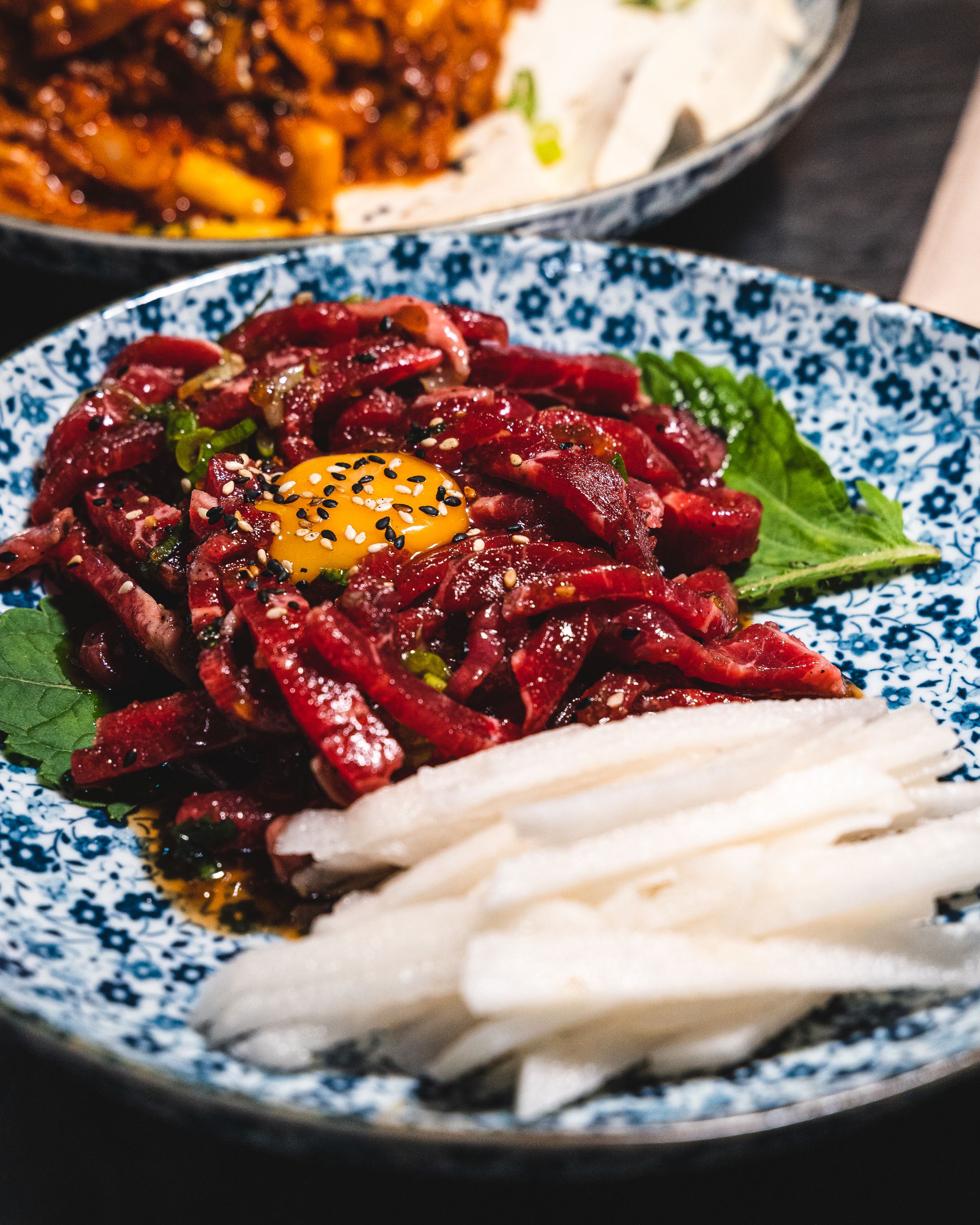 Close up of Korean beef tartare with a raw egg yolk showing