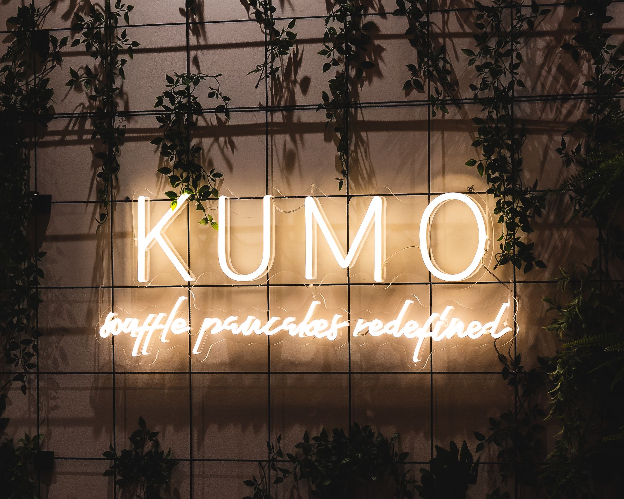 Kumo neon sign saying "souffle pancakes redefined"
