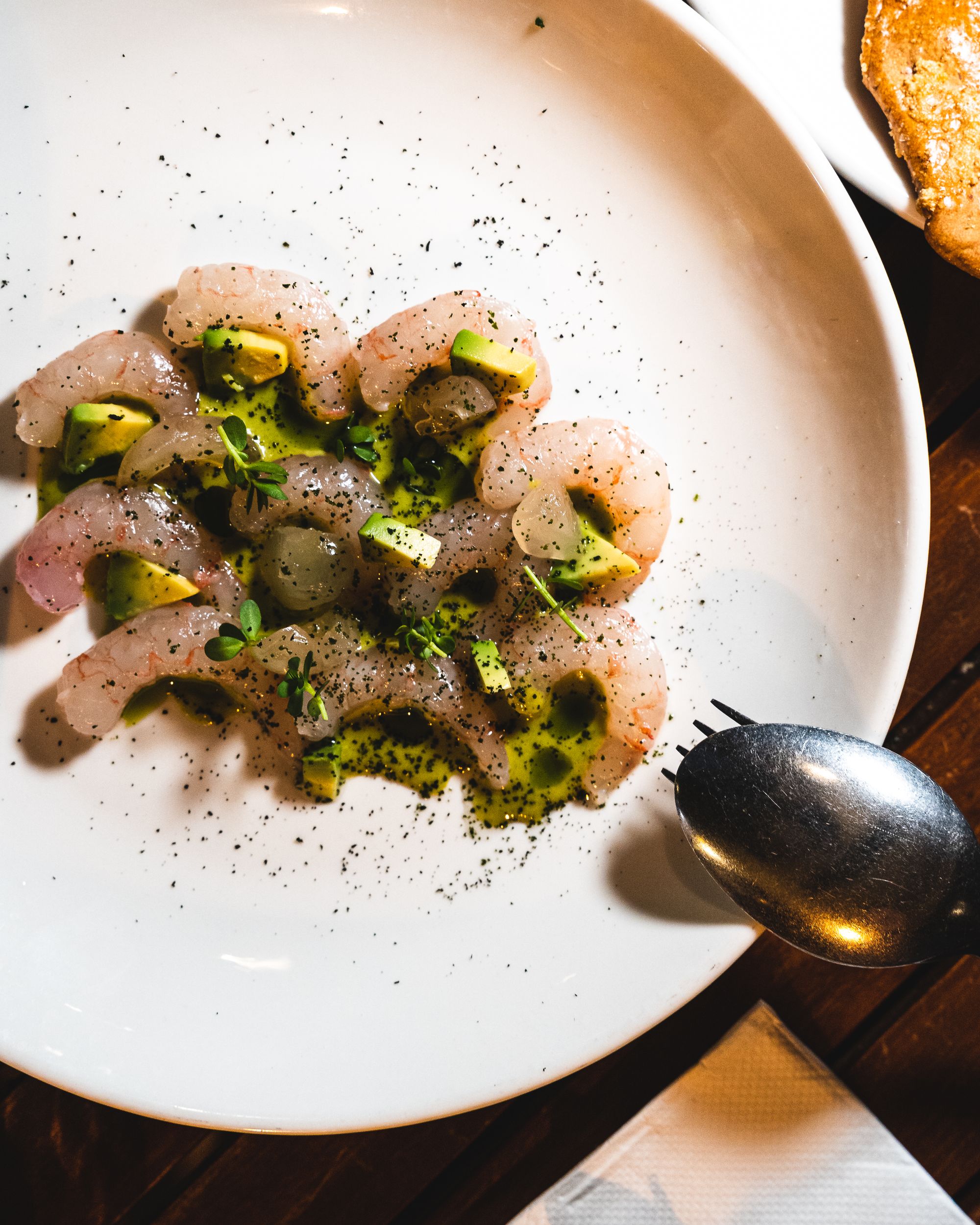 Overhead shot of ama ebi with longan and avocado