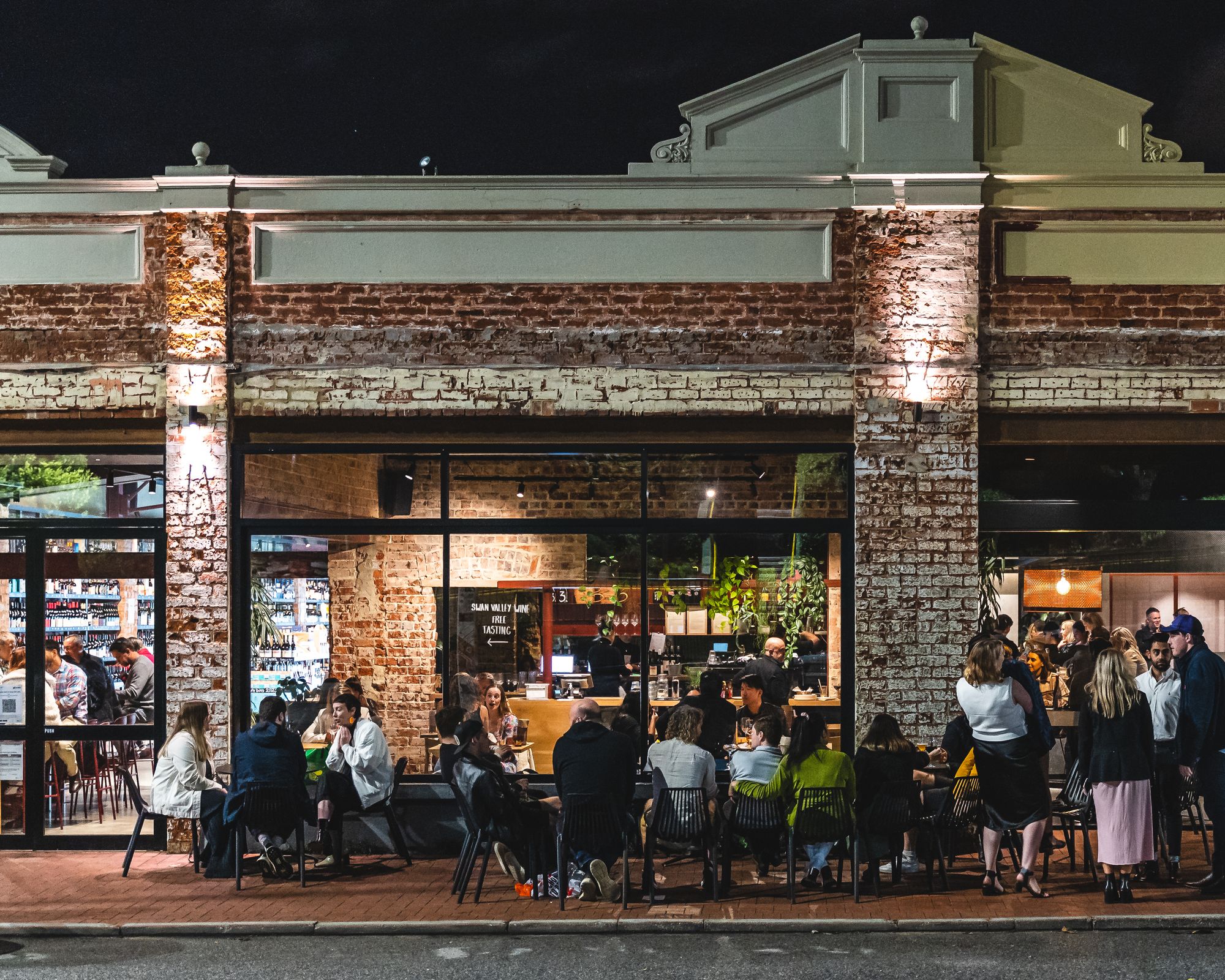 Besk exterior shot with a crowd of people outside