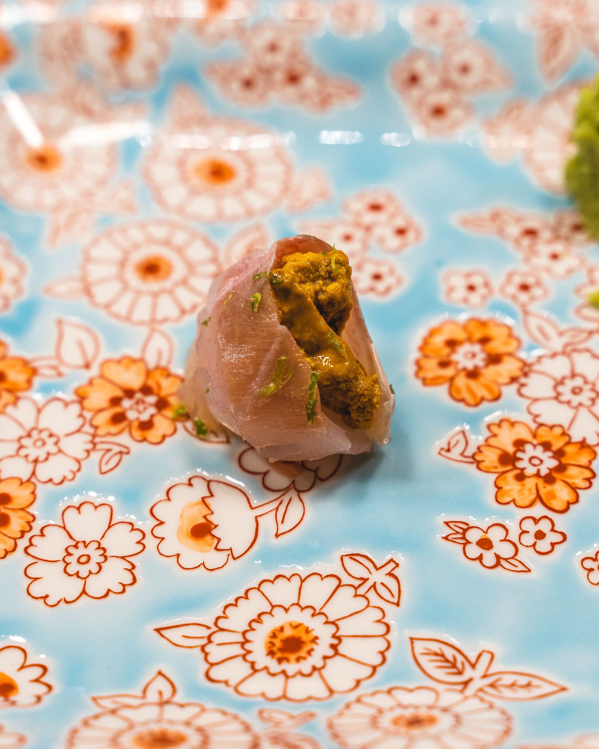 Close up of grouper sashimi with sea urchin