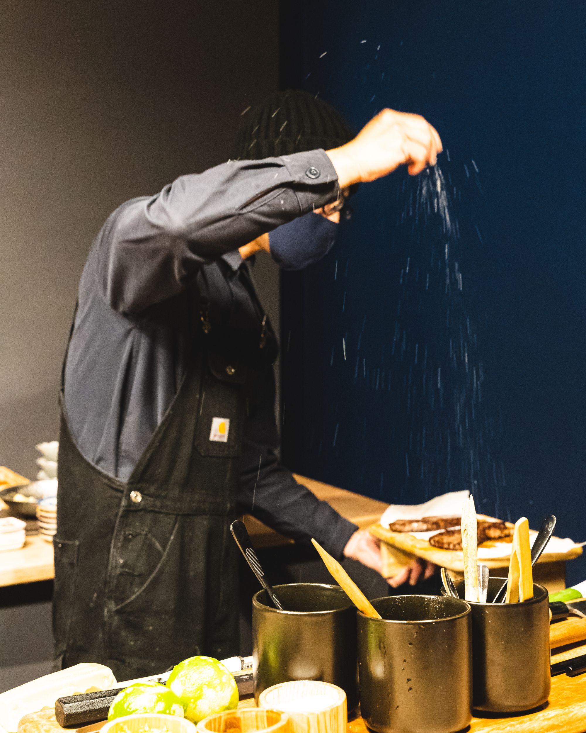 Chef sprinkling salt onto wagyu