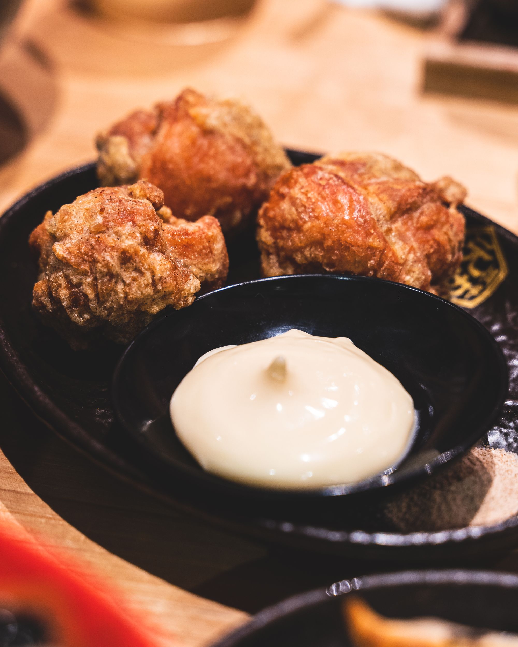 Close up of karaage chicken with a side of mayo