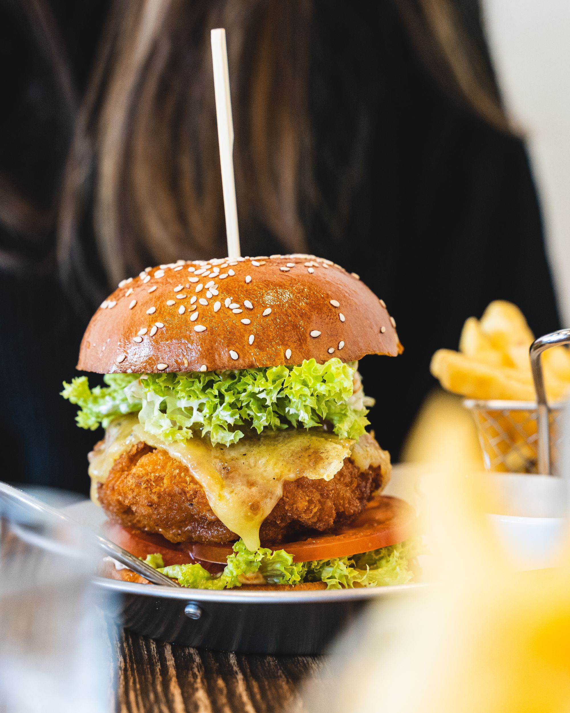 Close up of burger with cheese oozing out