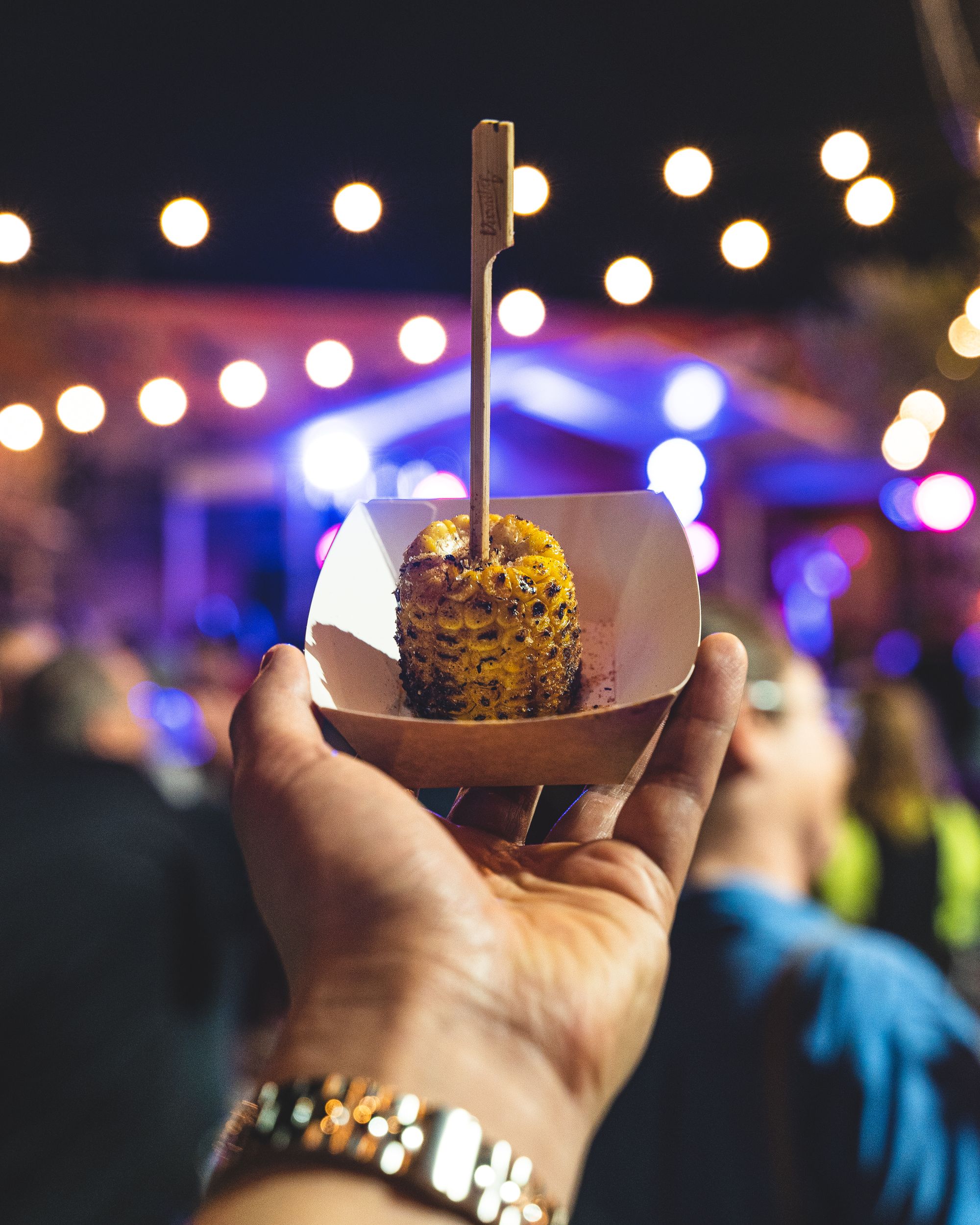 Hand holding a piece of corn