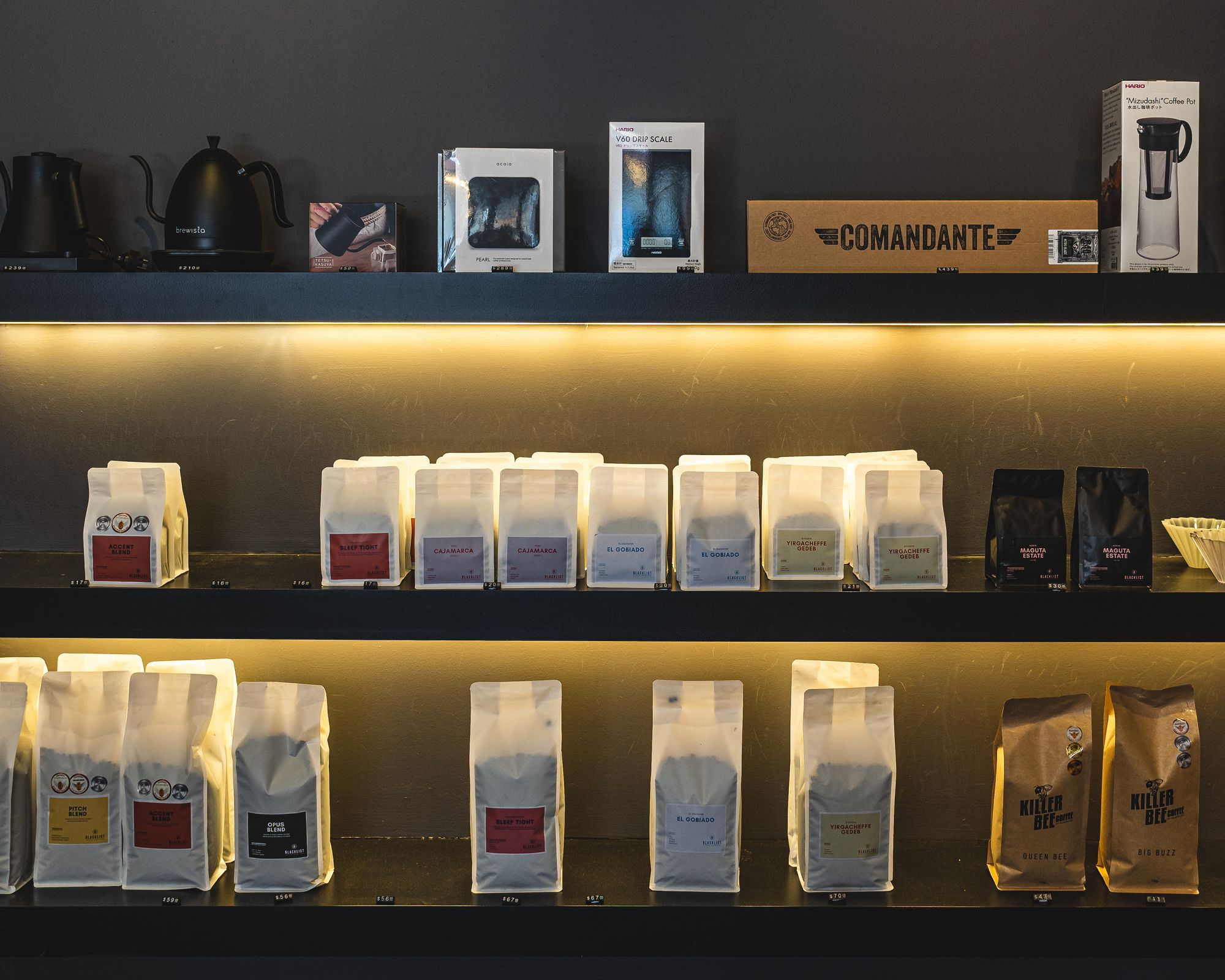 A number of coffee beans on display on a shelf