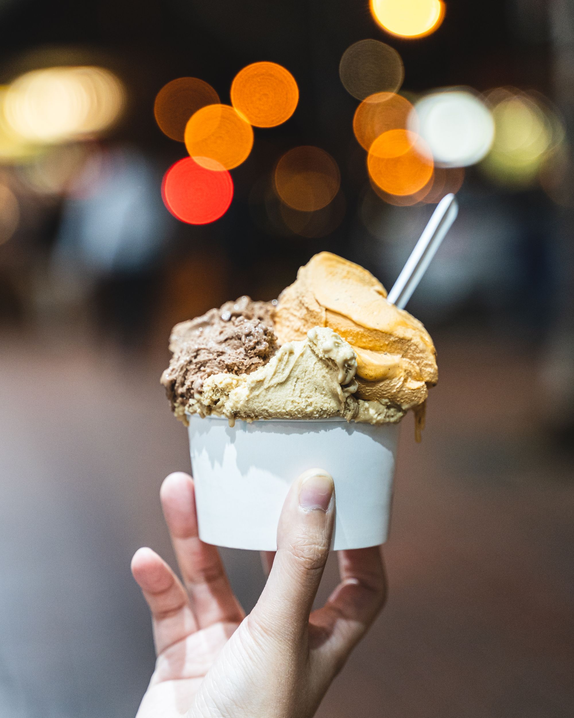 Hand holding a cup of gelato