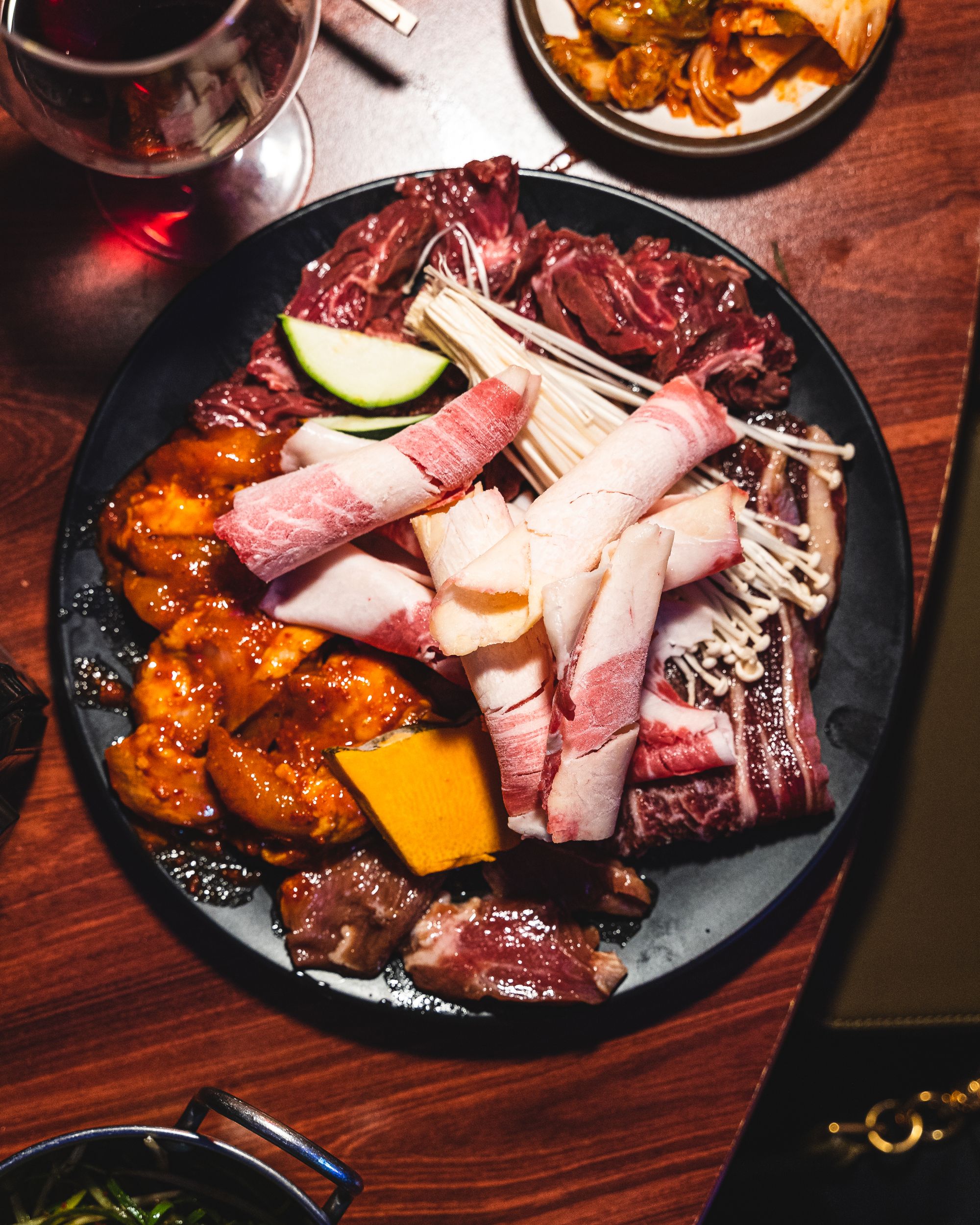 Close up of raw KBBQ meats on a plate