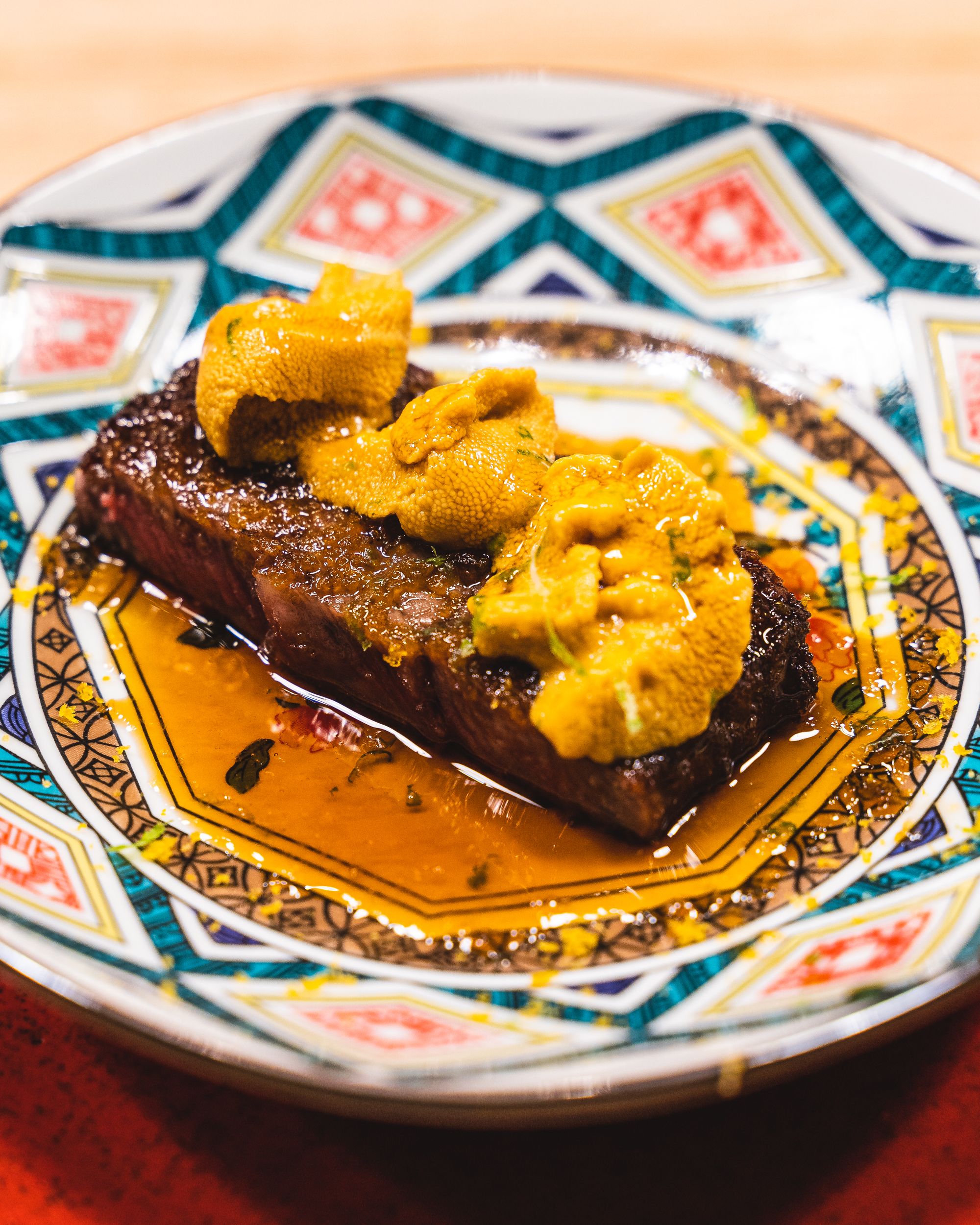 Close up of Australian wagyu served with uni on top