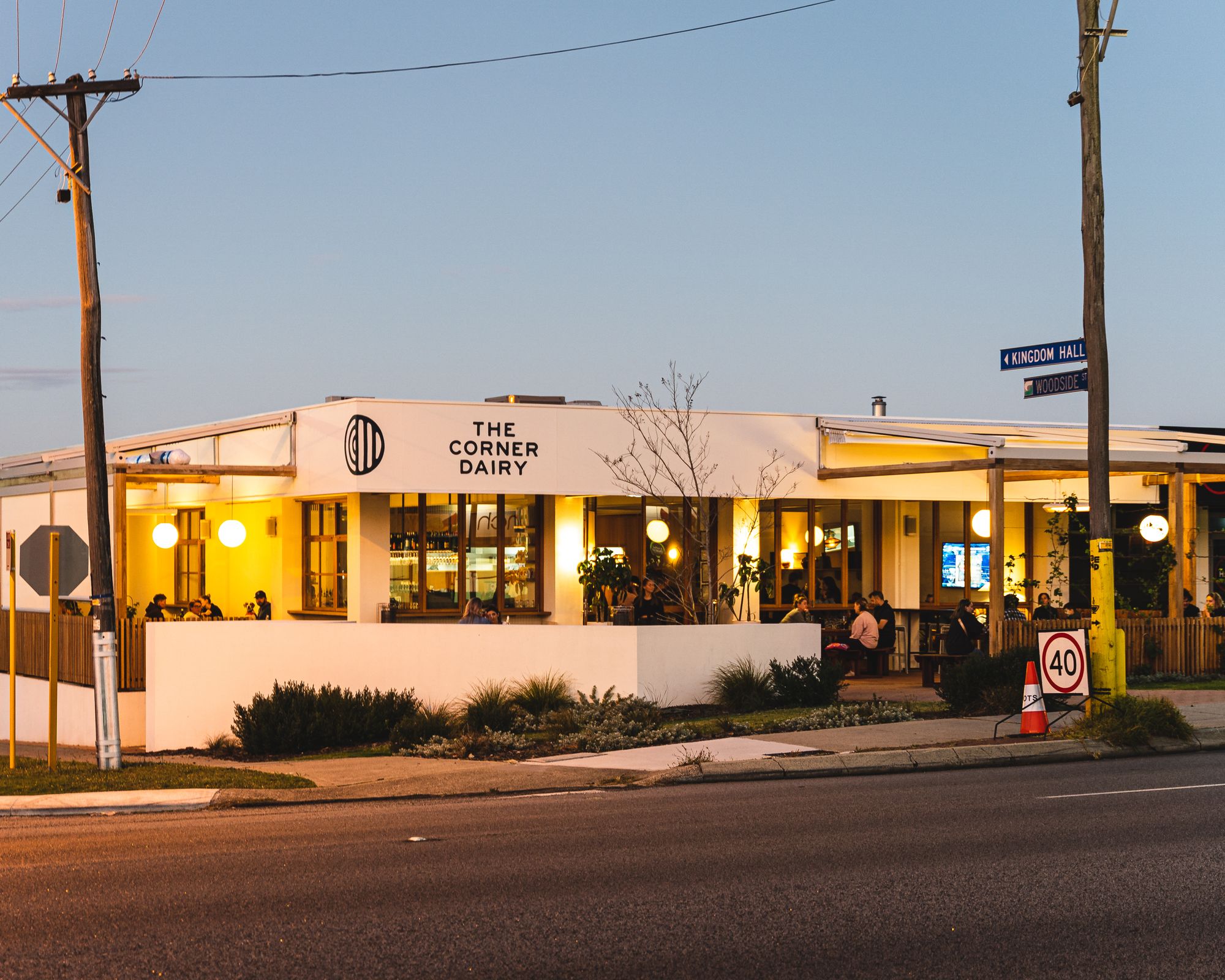 Exterior of The Corner Dairy at sunset