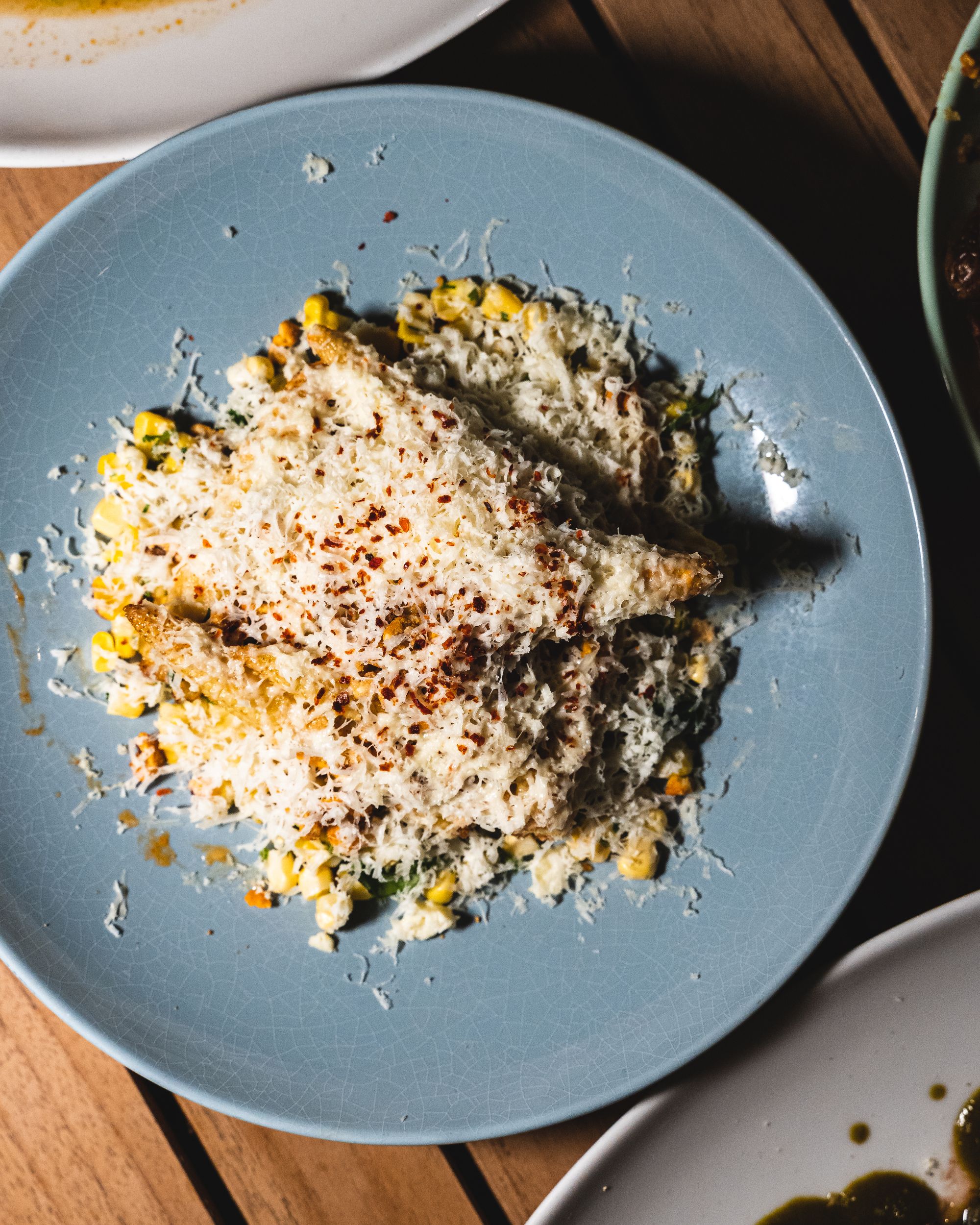 Top down shot of a corn dish with shaved corn