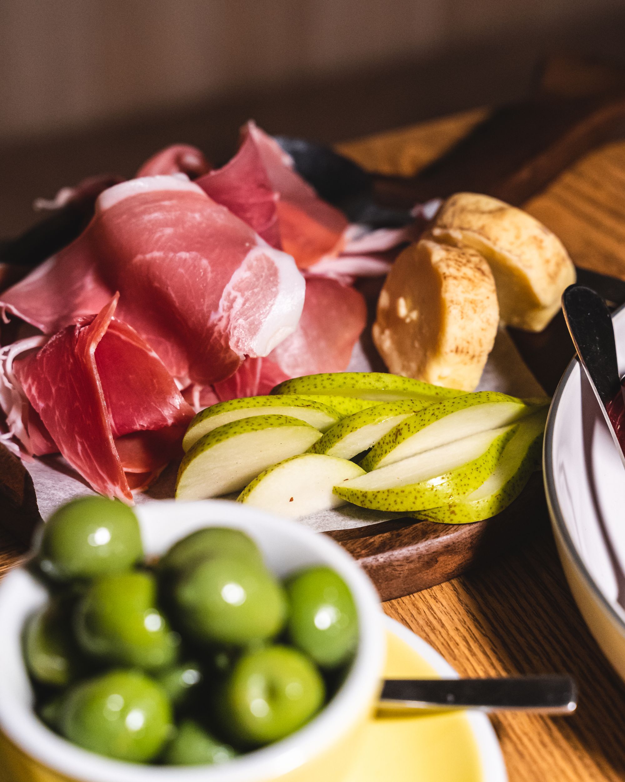 Charcuterie meat, cheese, pears and olives