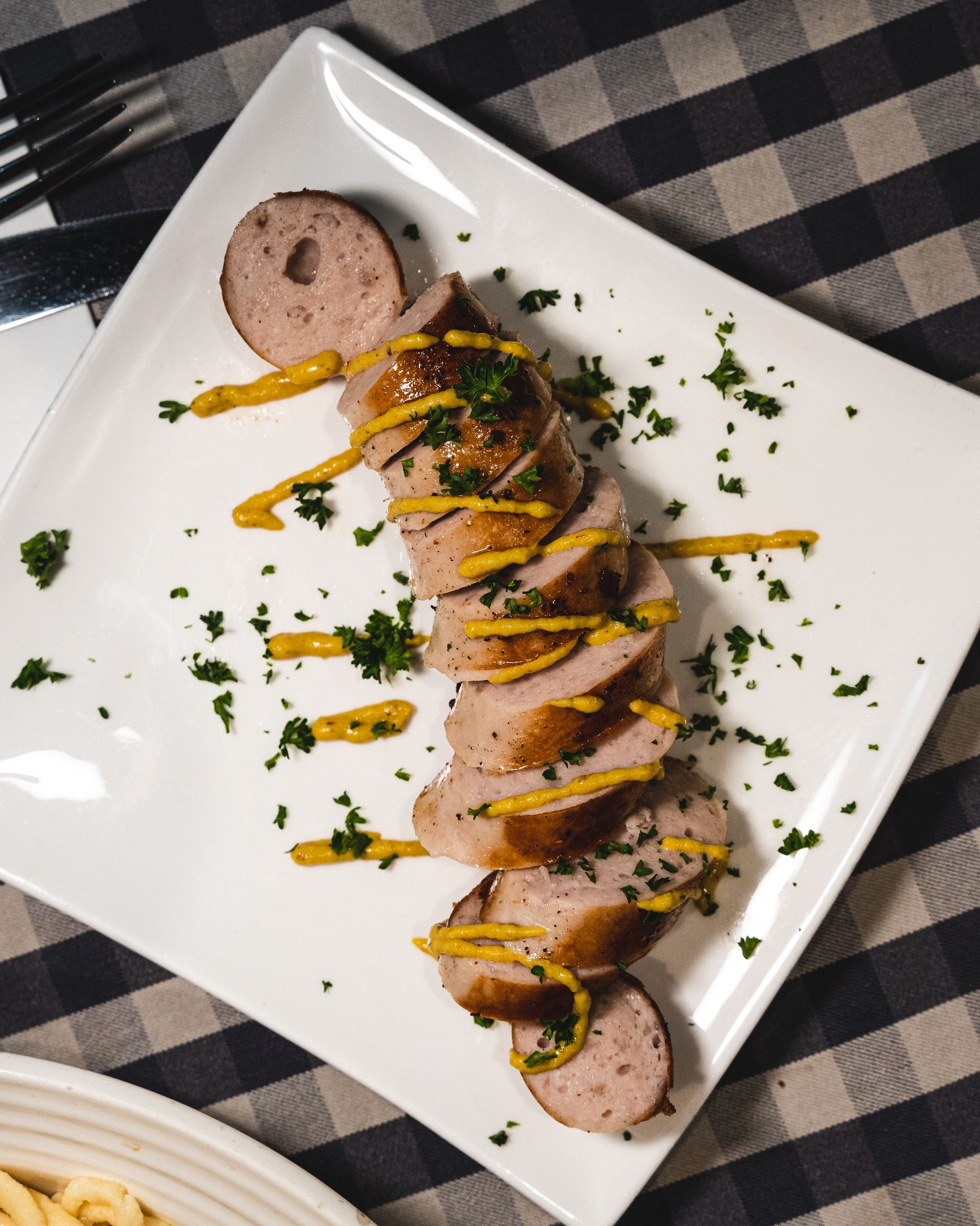 Top down shot of bratwurst with mustard