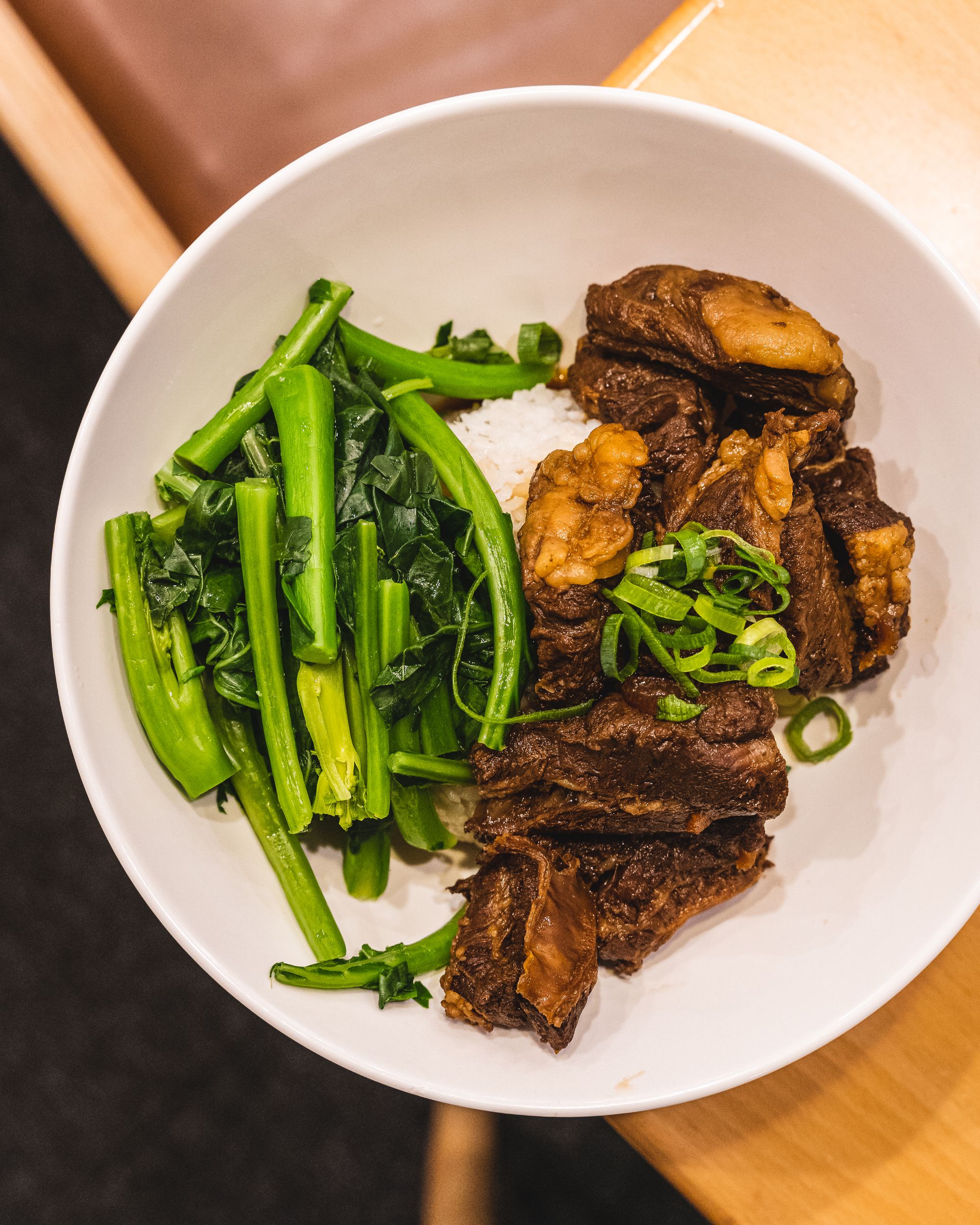 Top down shot of vegetables, rice and beef brisket