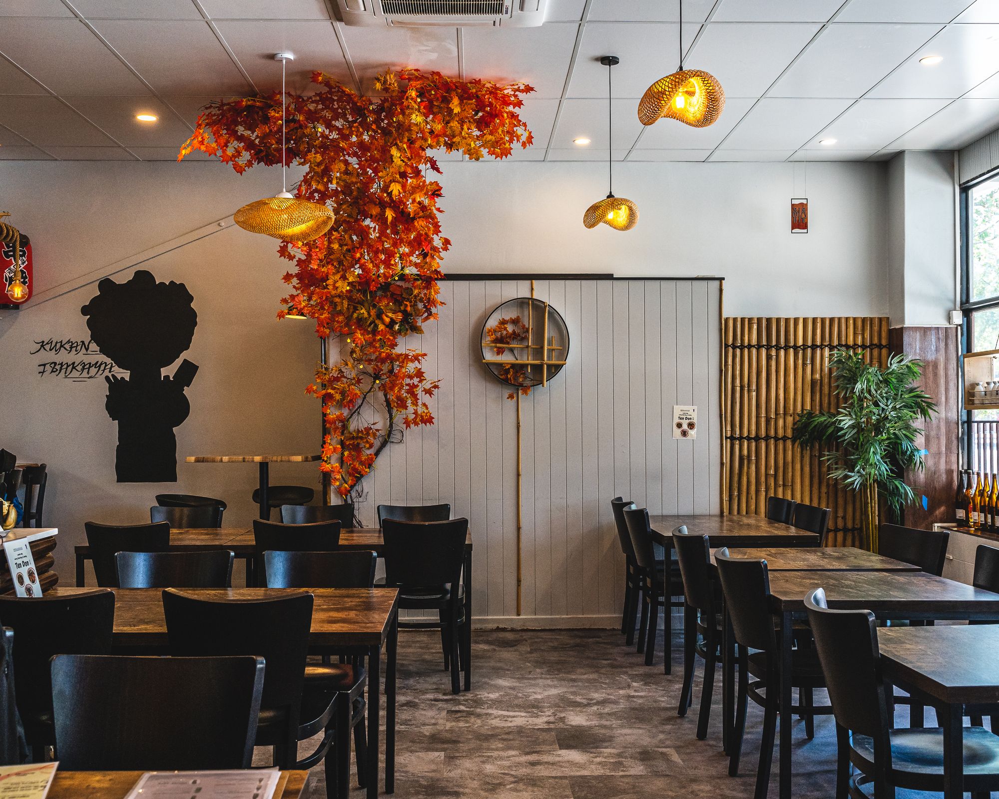 Interior shot of Kukan Izakaya showing tables