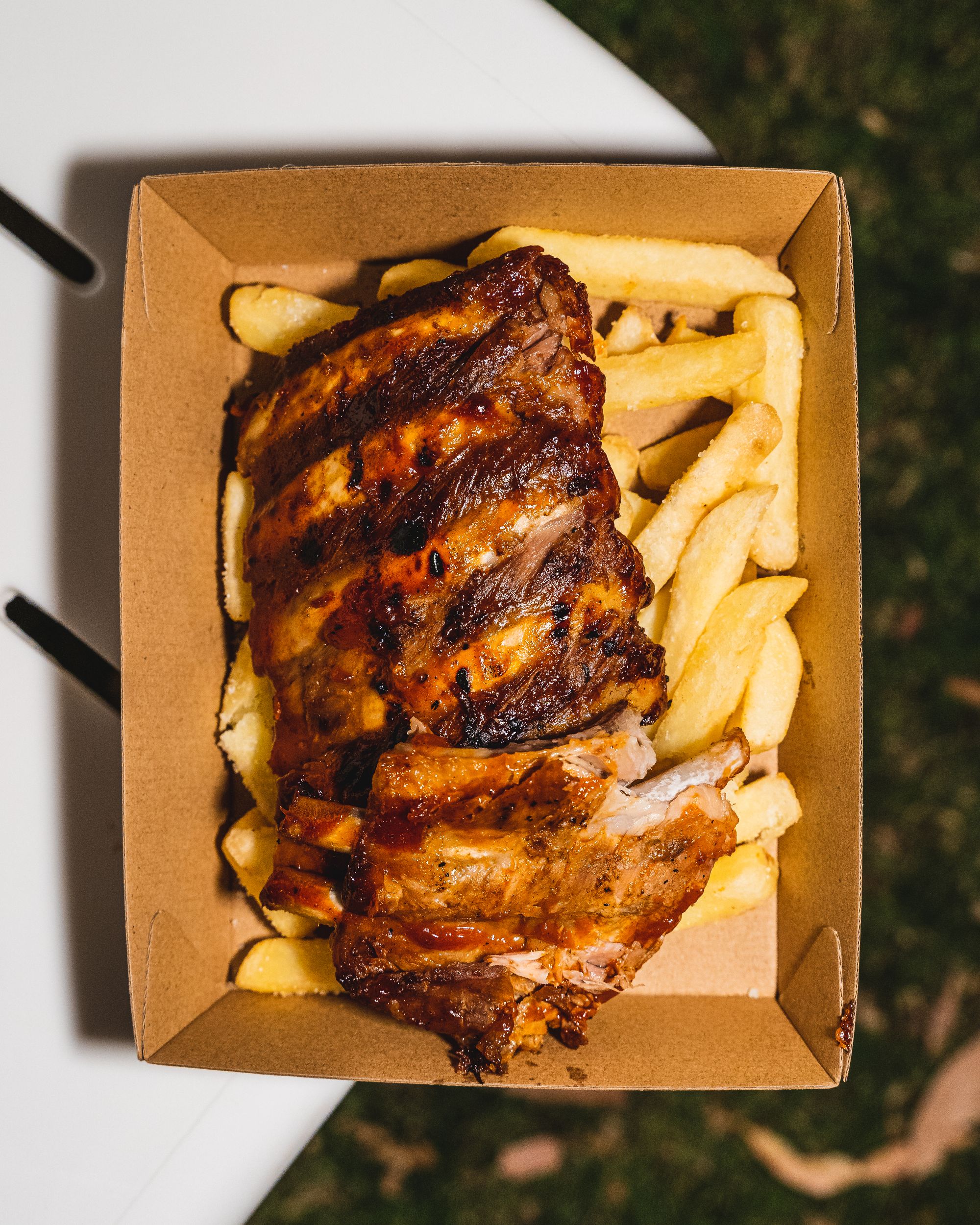 Top down shot of ribs on fries