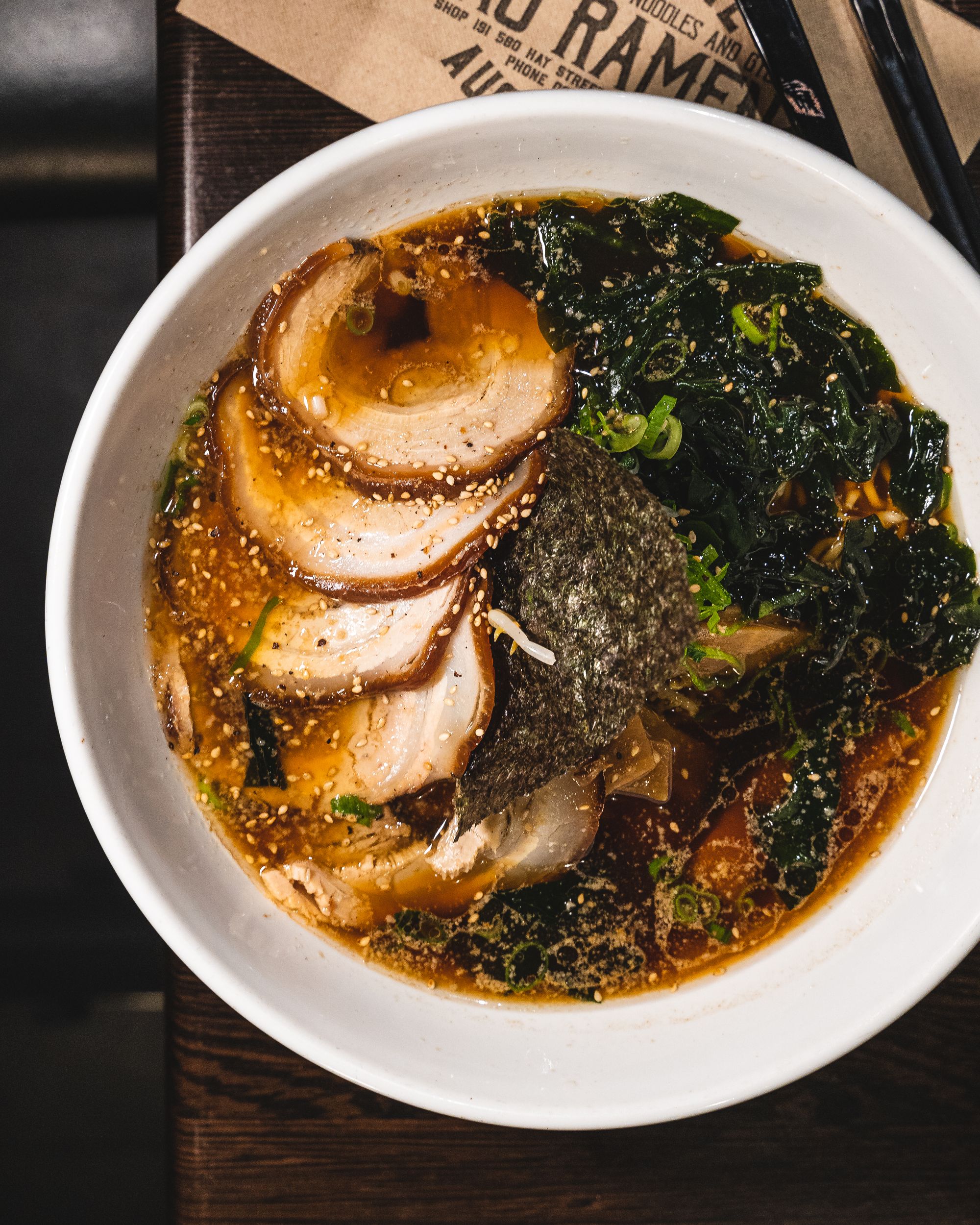 Top down shot of shoyu ramen with chashu slices showing