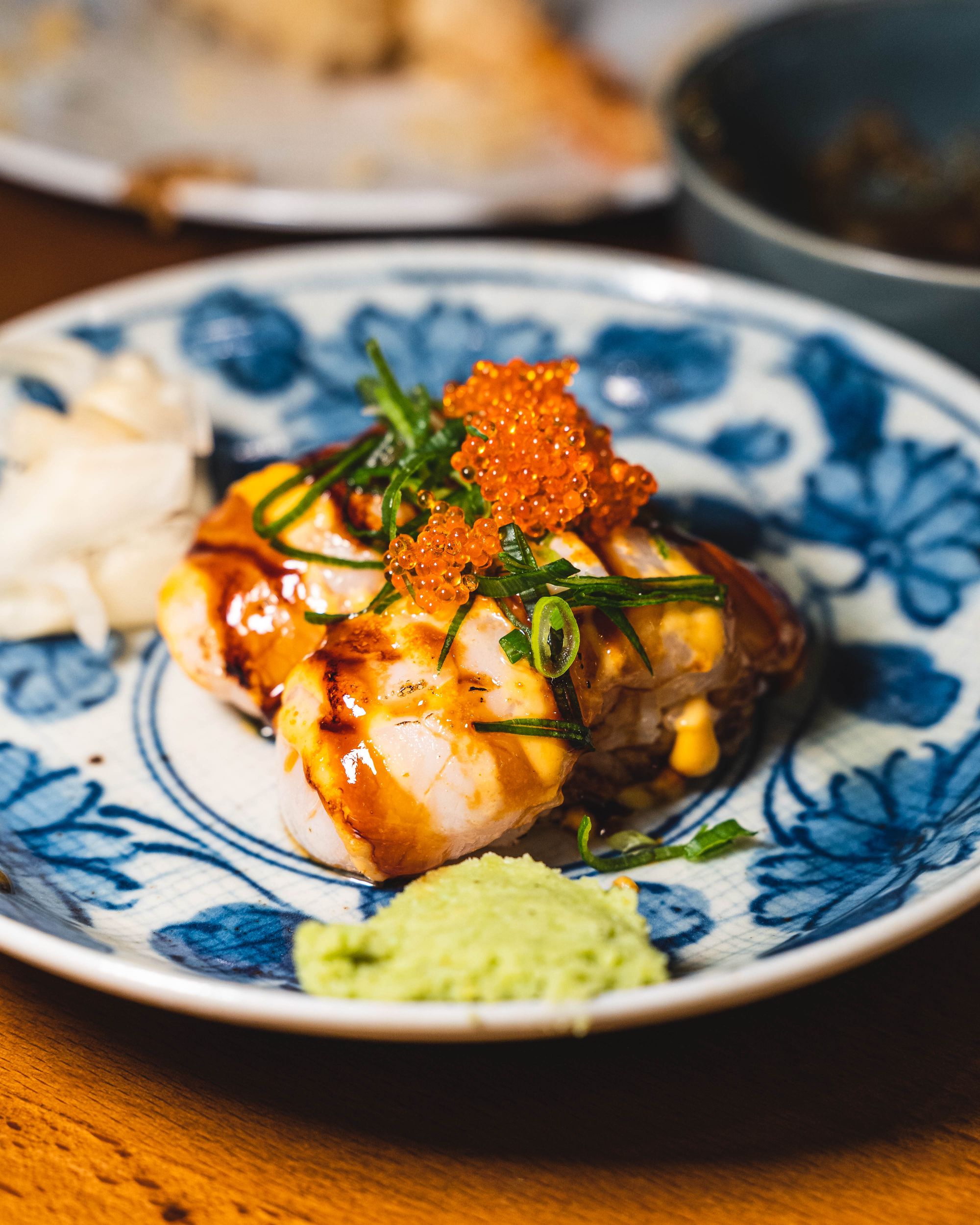 Close up of grilled scallops with fish roe on top