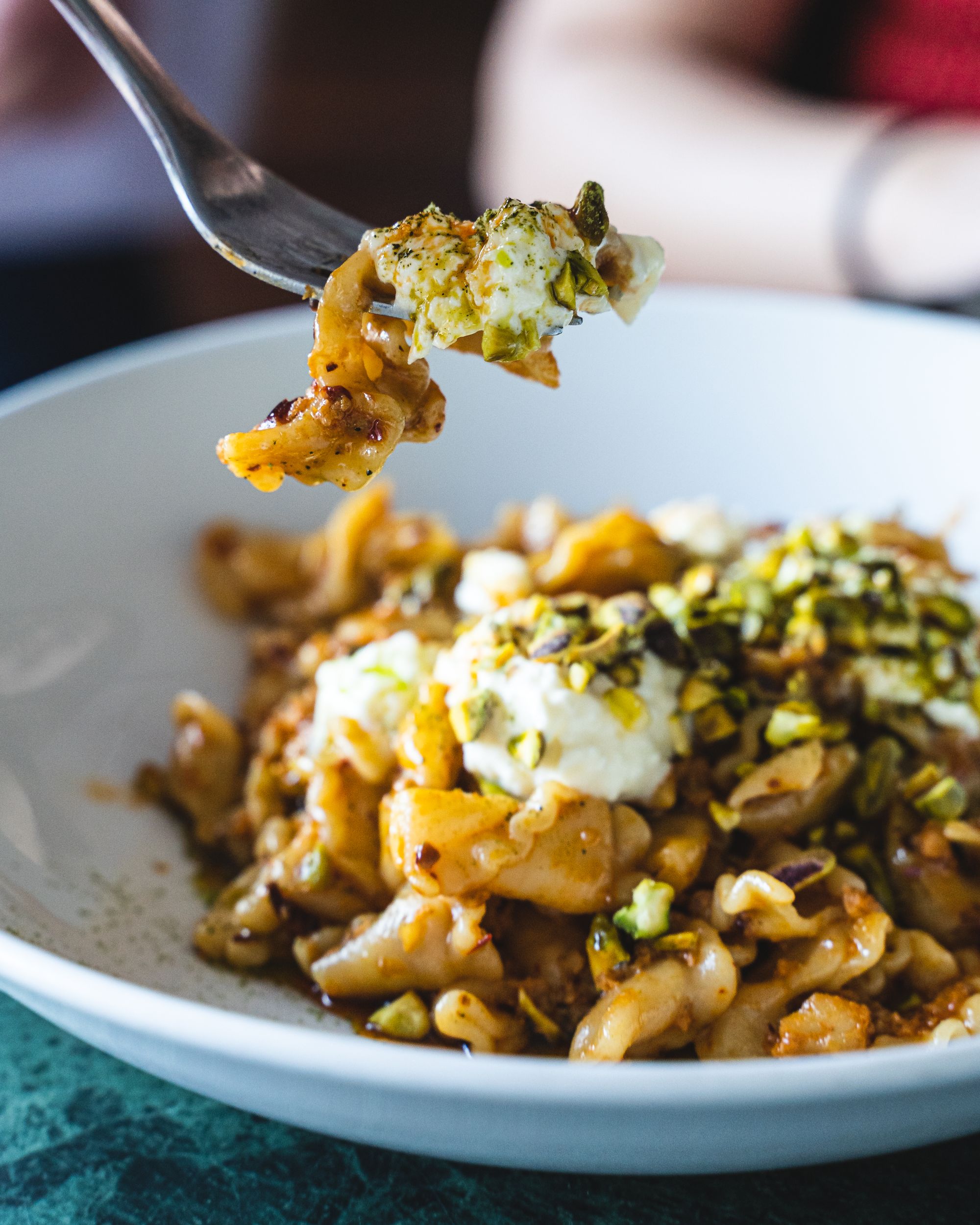 Pasta being lifted up by a fork