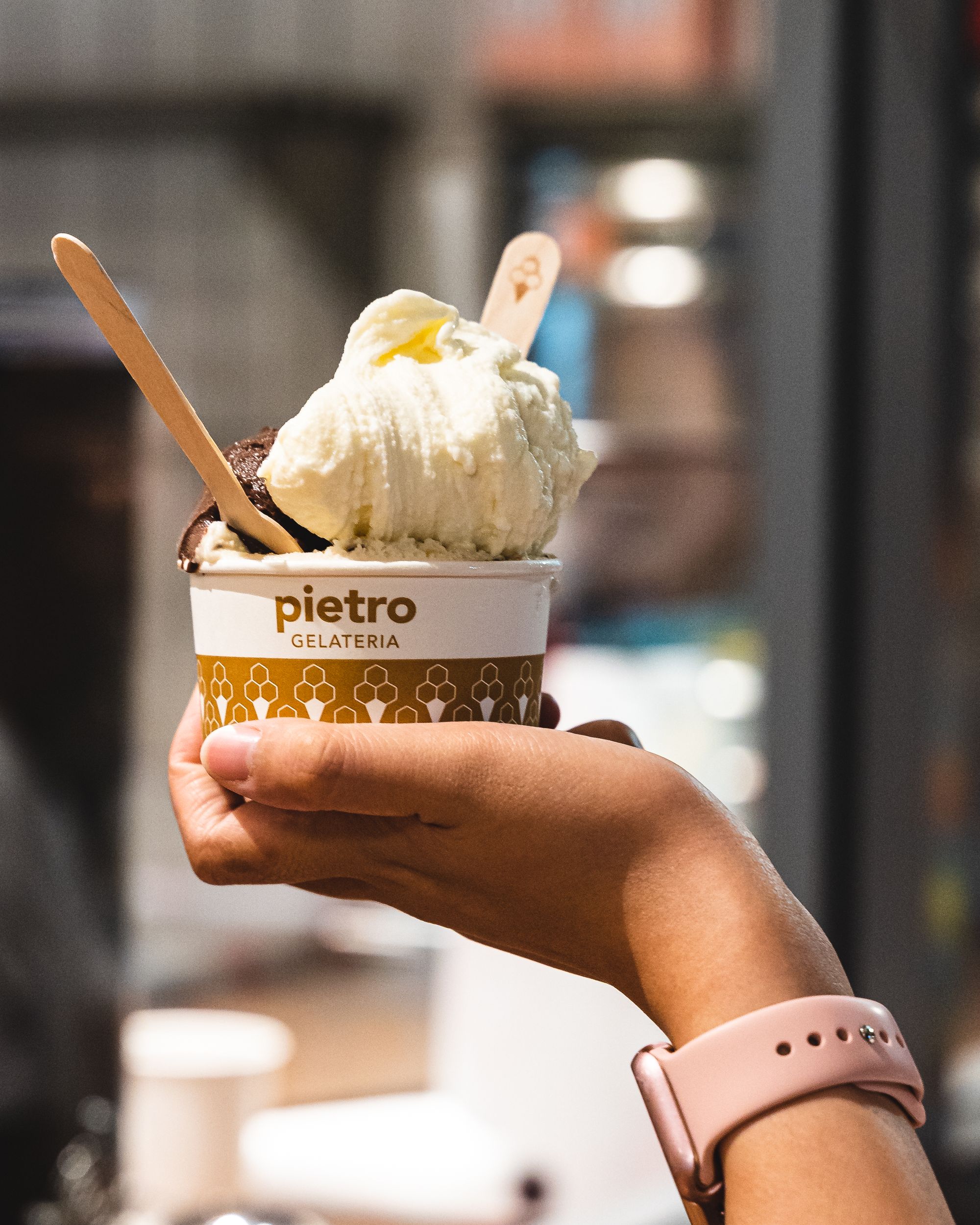 Hand holding a cup of gelato