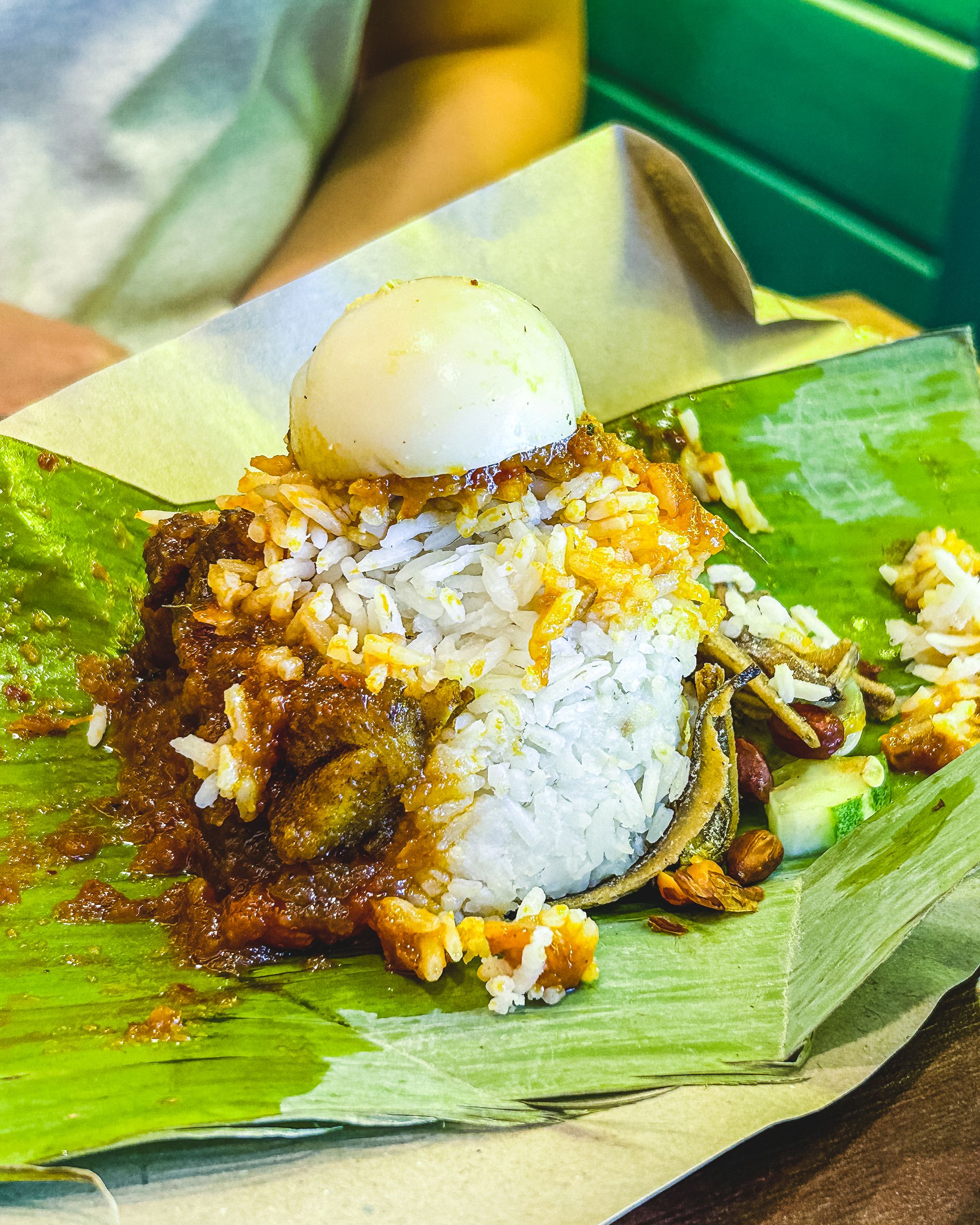 Nasi lemak served on a banana leaf