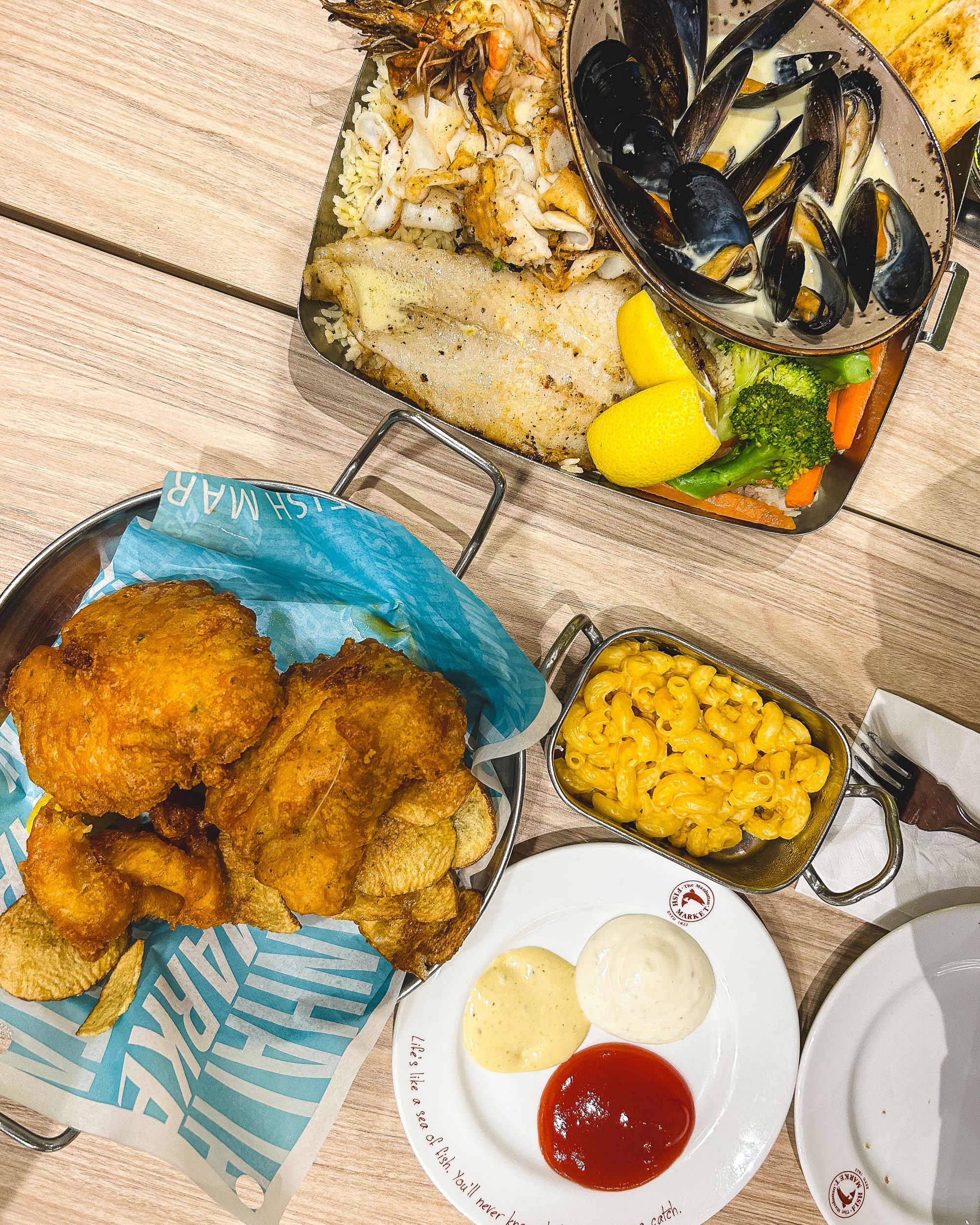 Grilled fish, butter rice, mussels, mac and cheese and fried fish