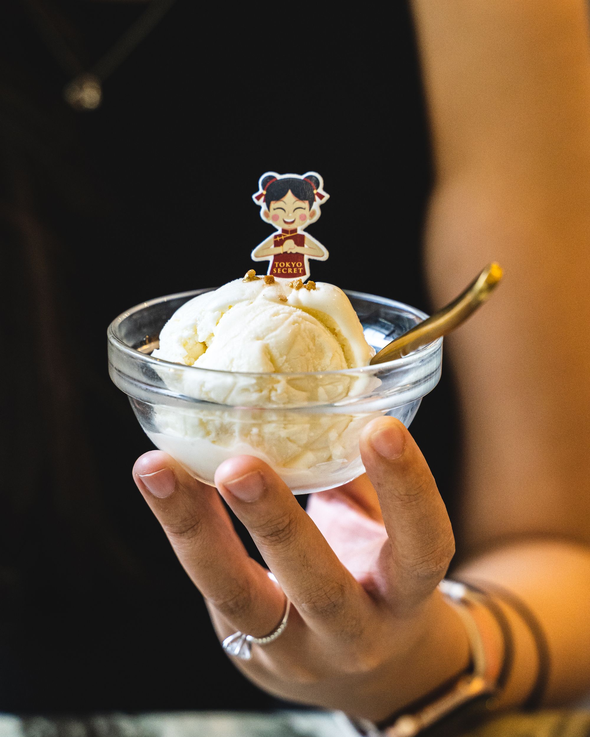 Hokkaido milk ice-cream with a Chinese New Year decoration of a girl in Chinese dress