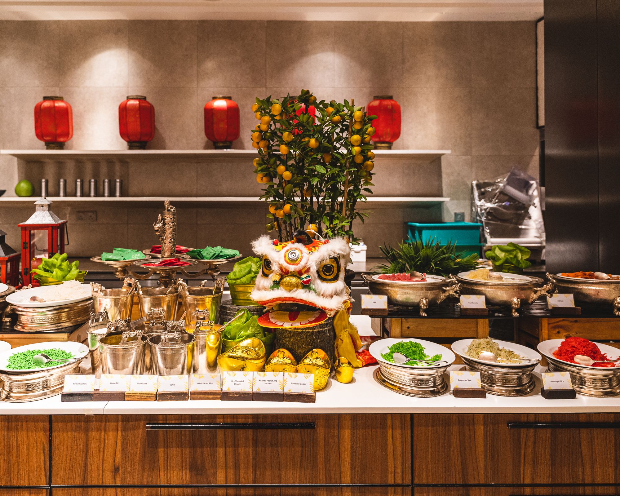 Chinese new year decorations on top of a buffet station