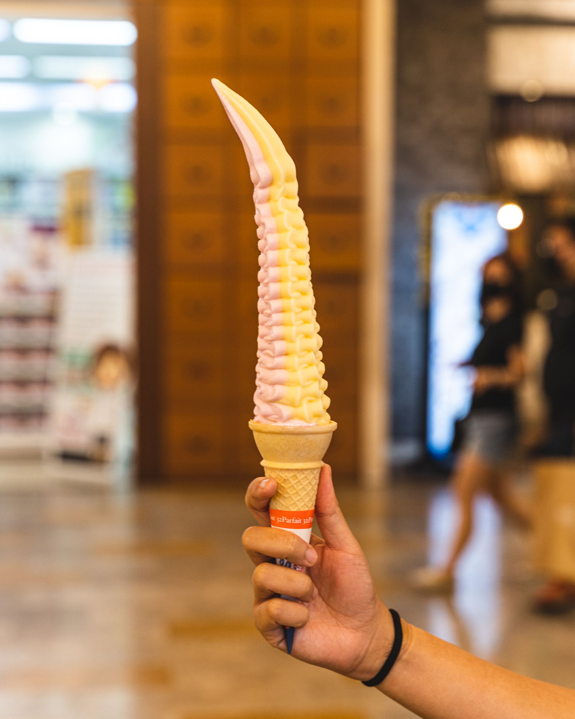 Hand holding a 32cm tall ice-cream