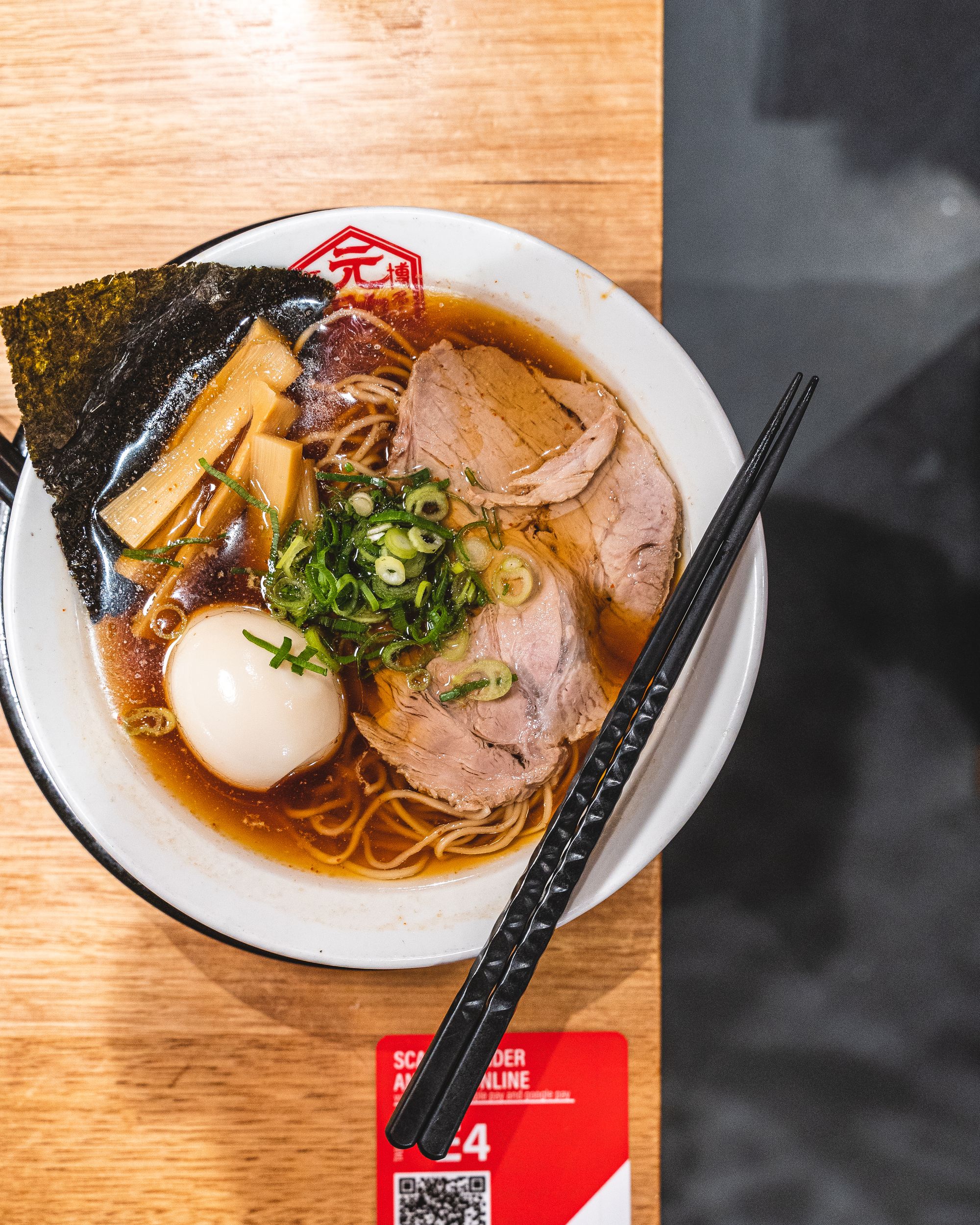 Top down shot of ramen with egg and spring onion