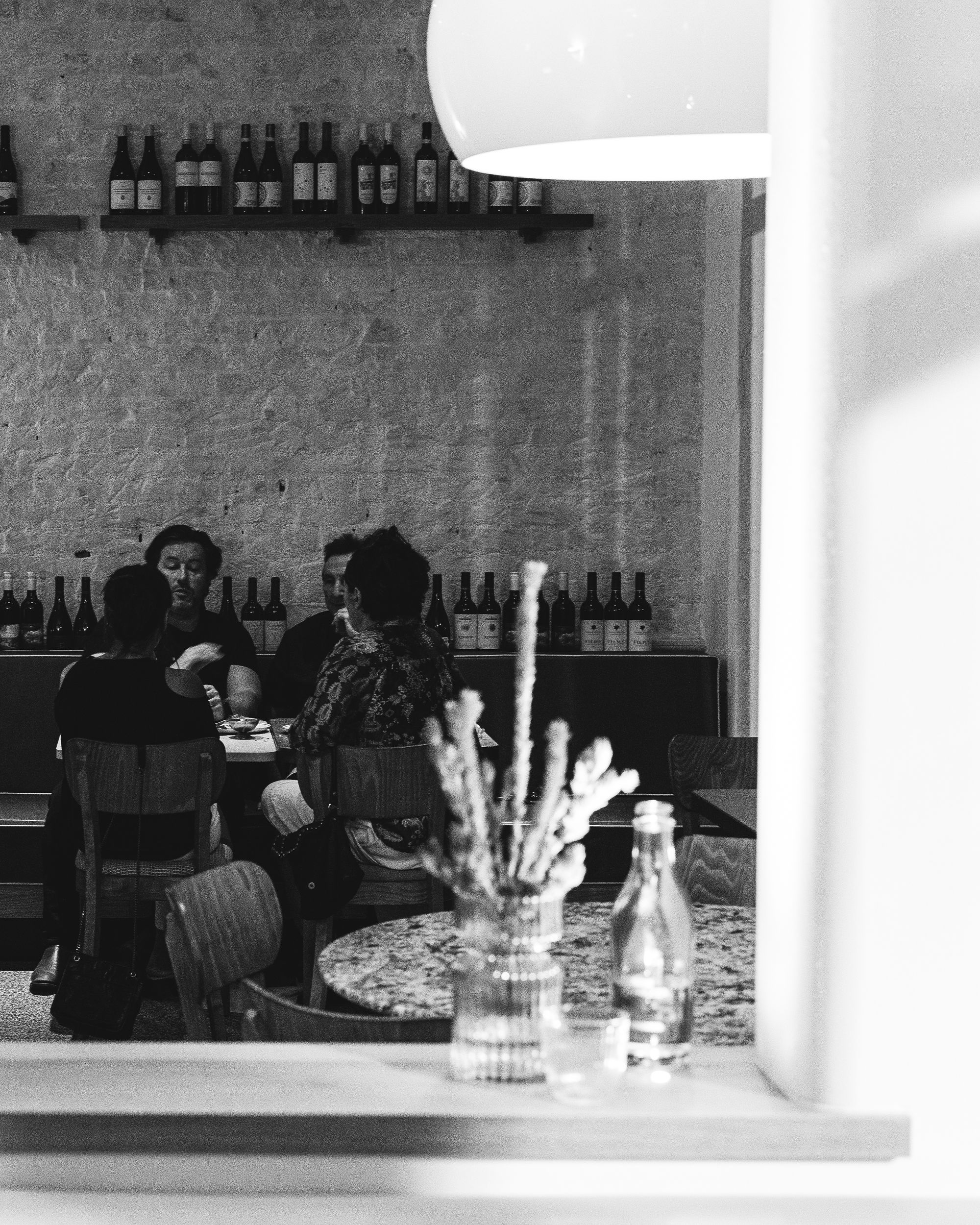 Black and white photo of guests dining in a restaurant