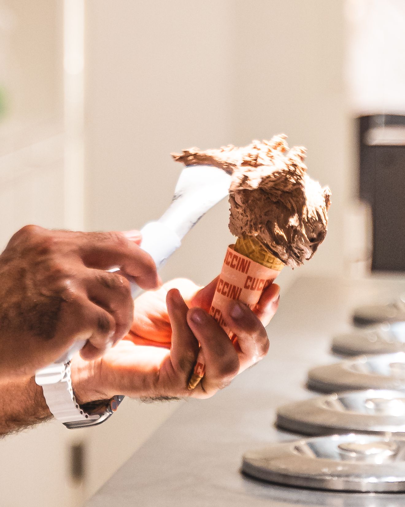 Hand scooping gelato