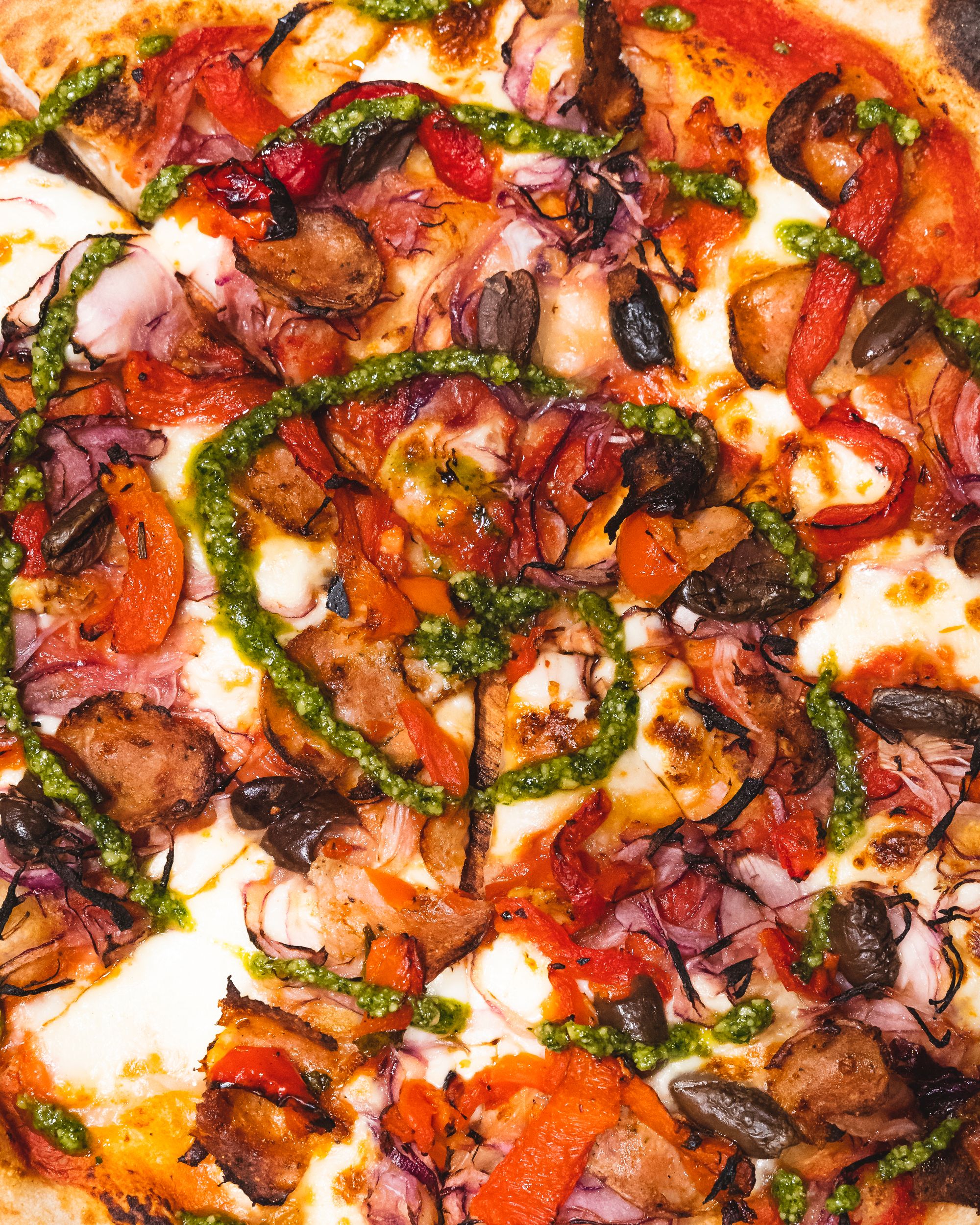 Top down, close up shot of pizza with various toppings