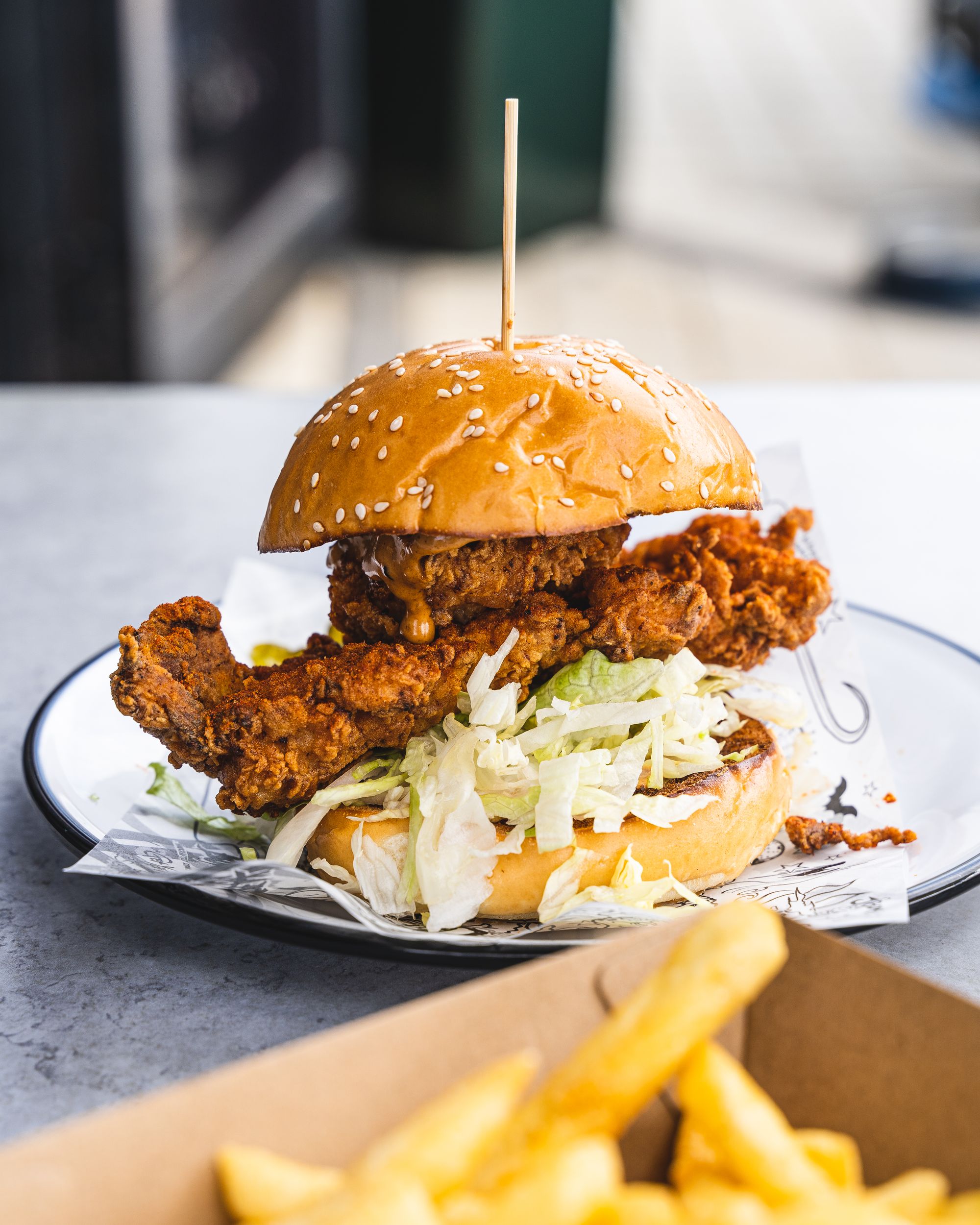 Close up of fried chicken burger with lettuce