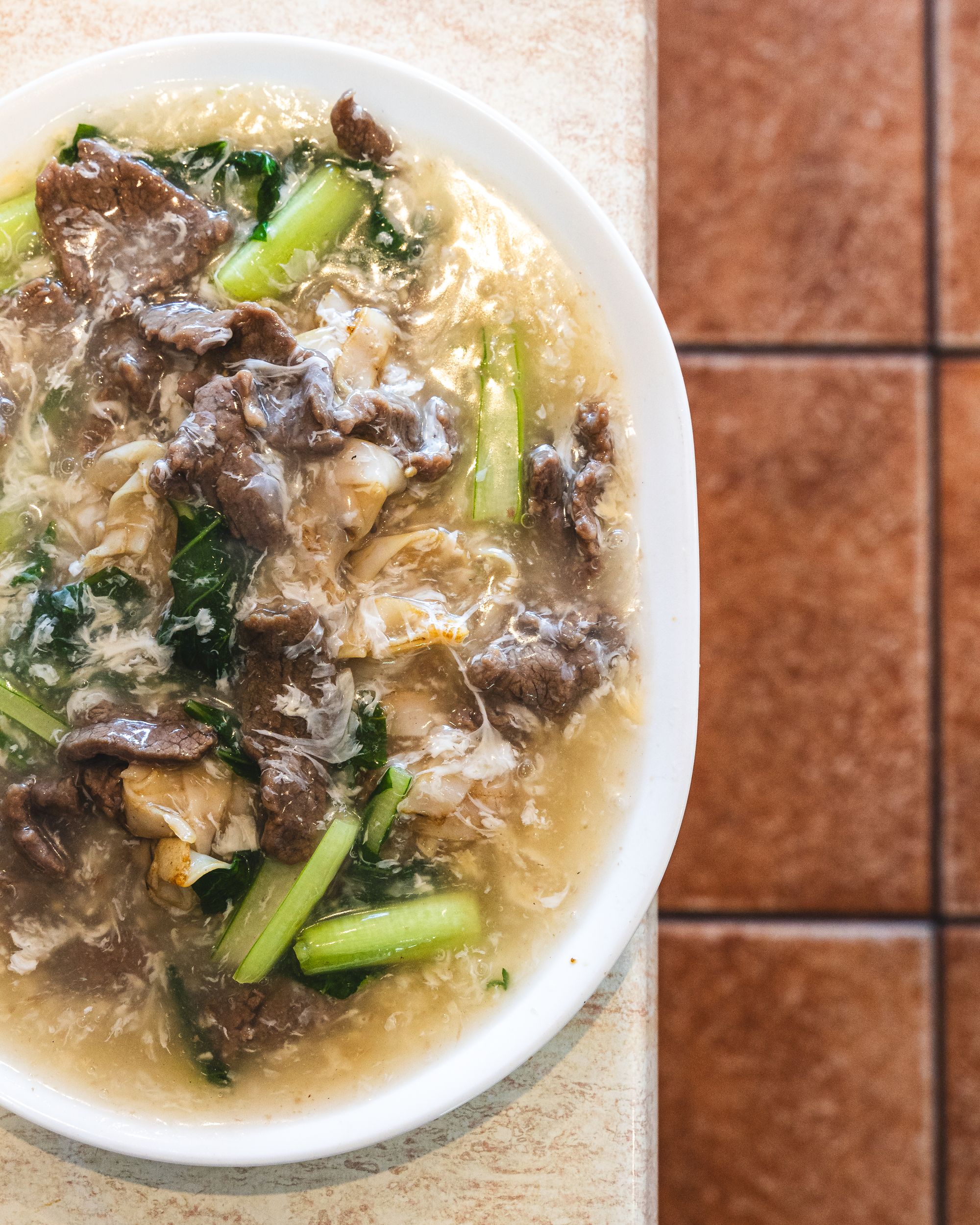 Top down shot of fried hofun in egg sauce