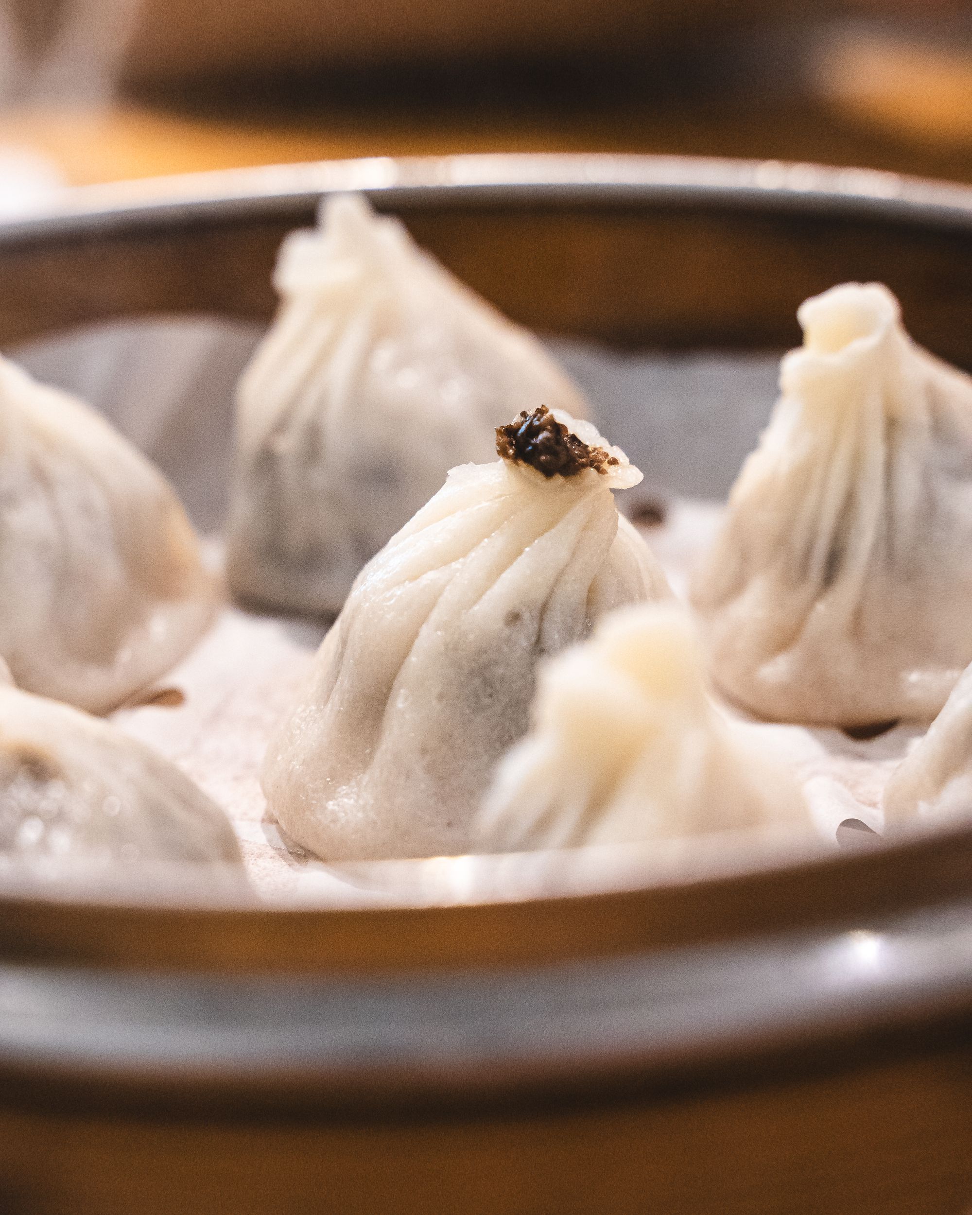 Close up of xiao long bao in steamer