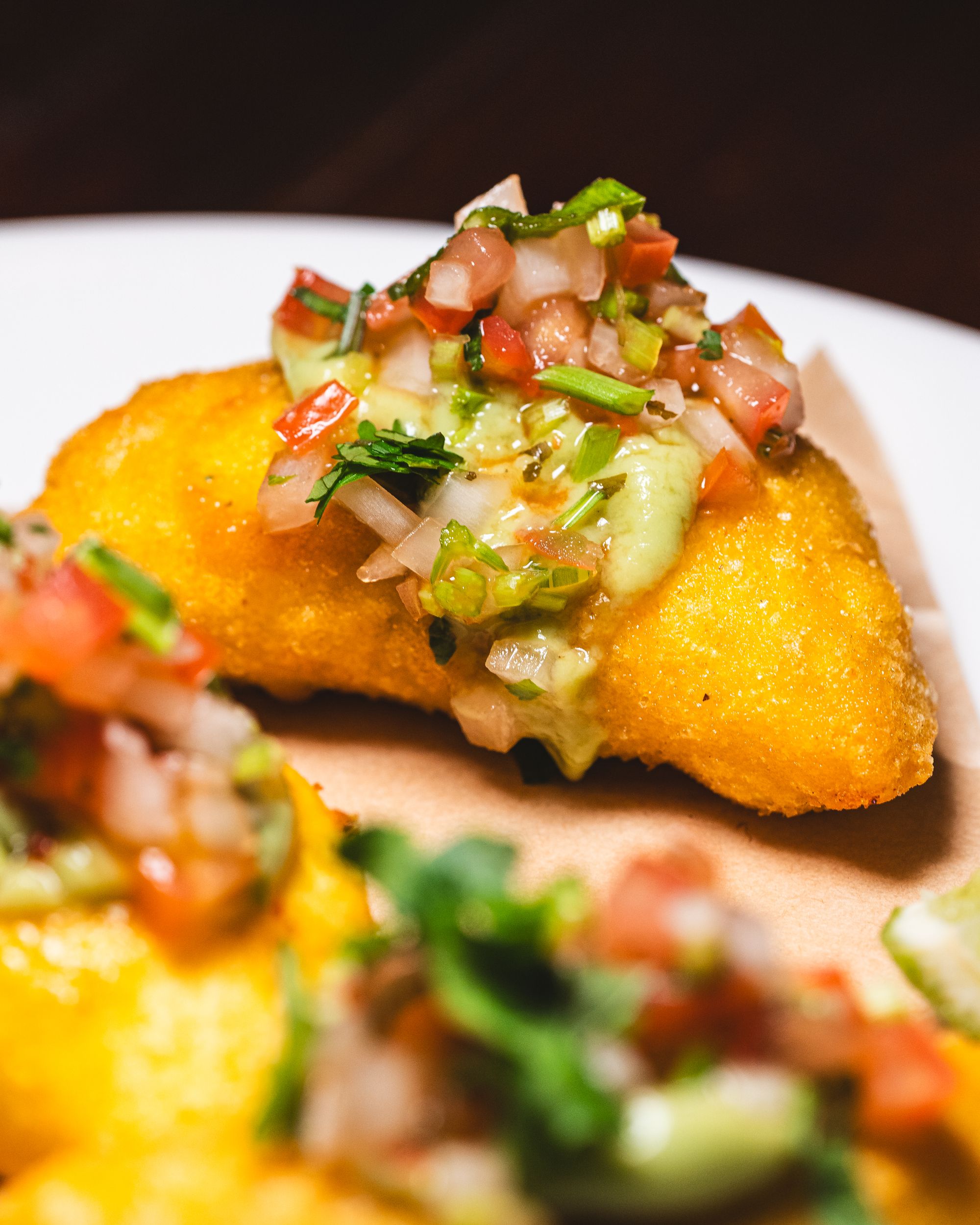 Close up of empanada with salsa