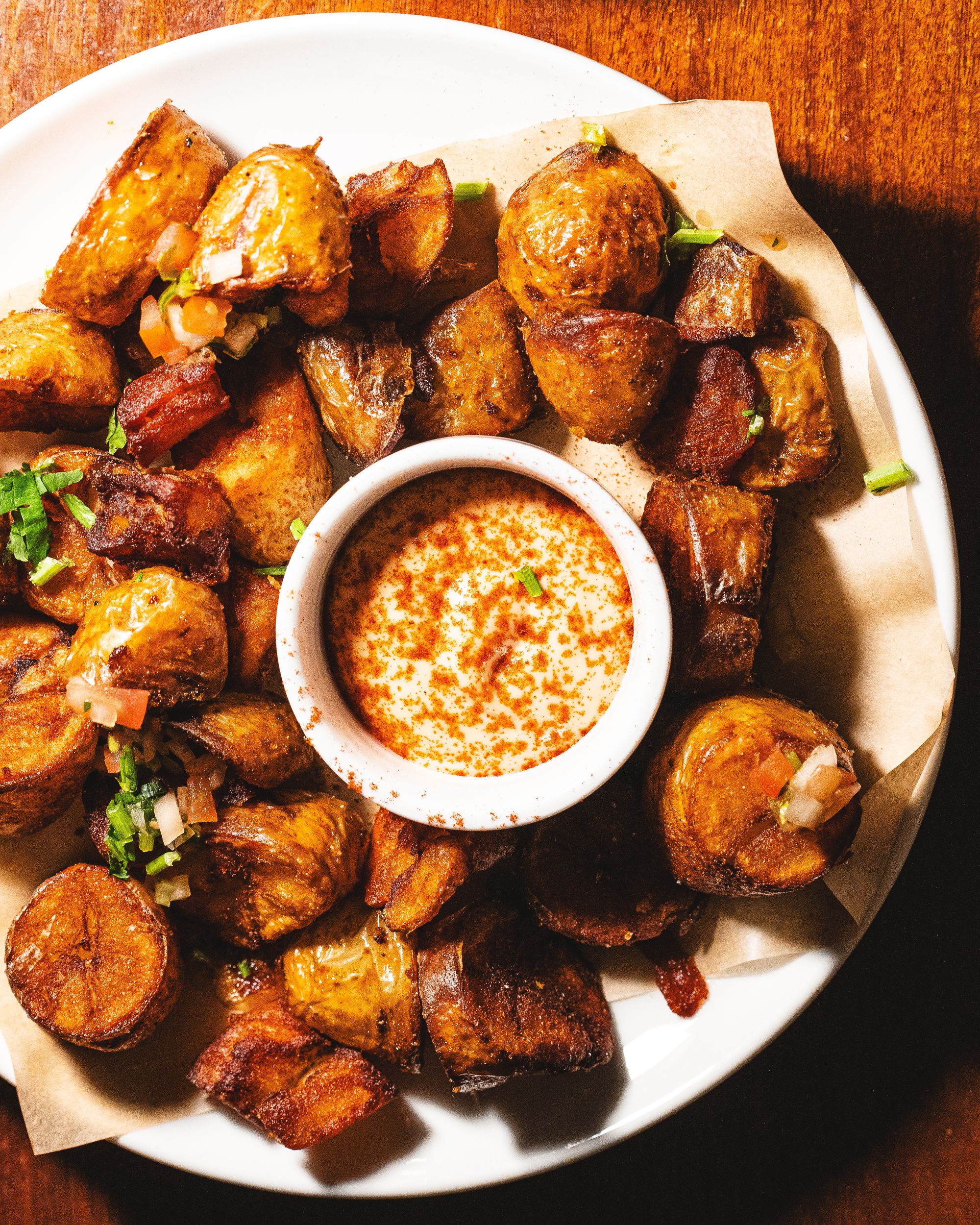 Top down shot of fried potato with aji sauce