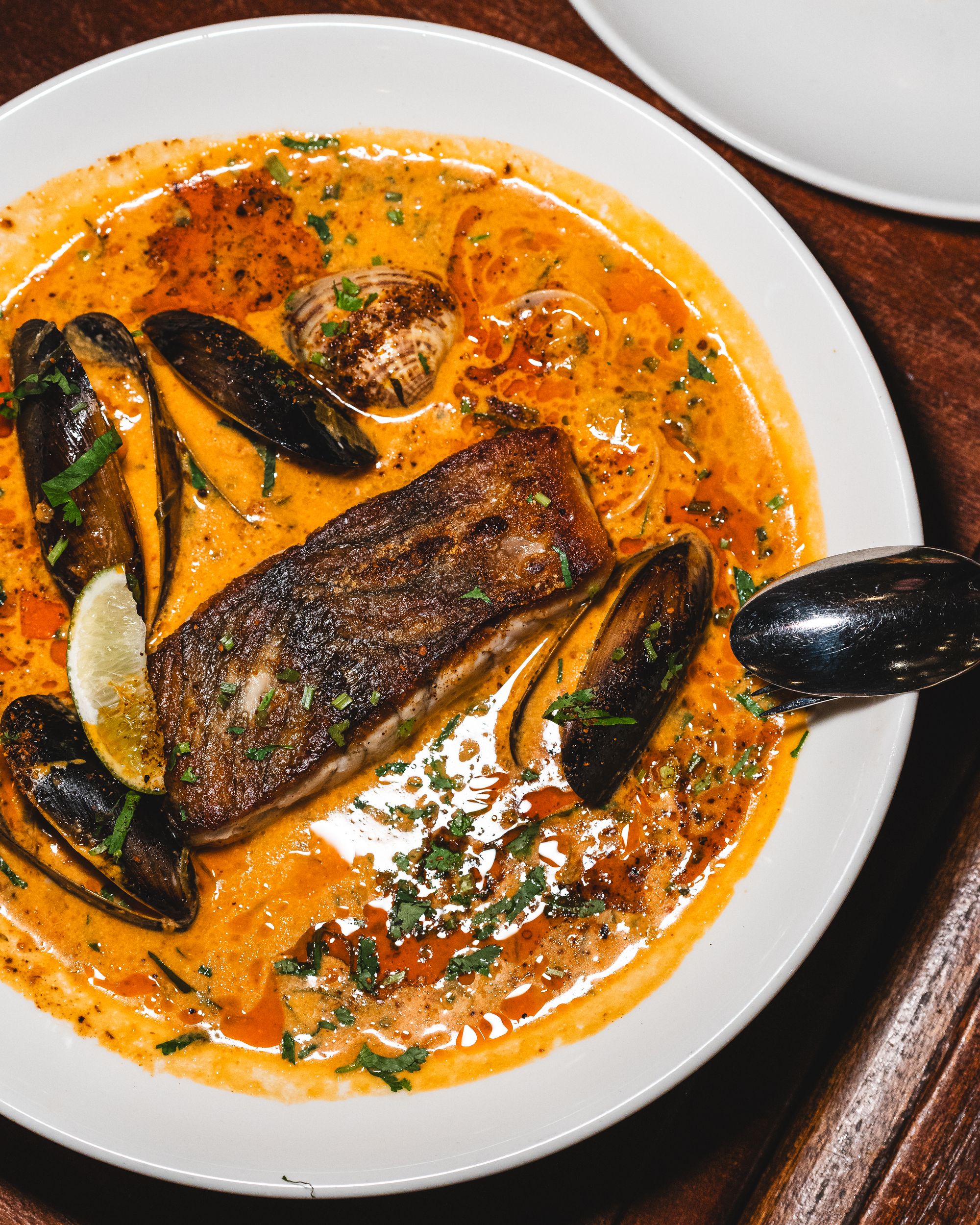 Top down shot of barramundi in coconut sauce