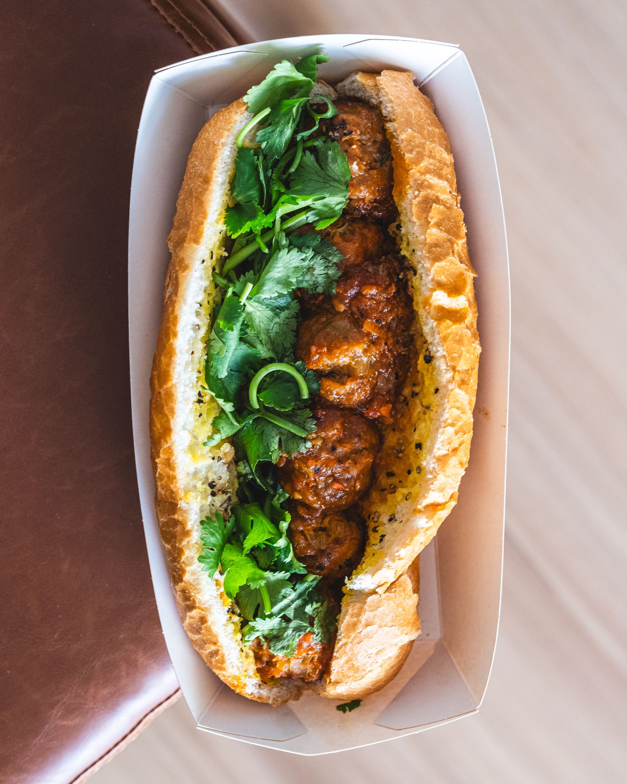 Top down of banh mi with meatballs