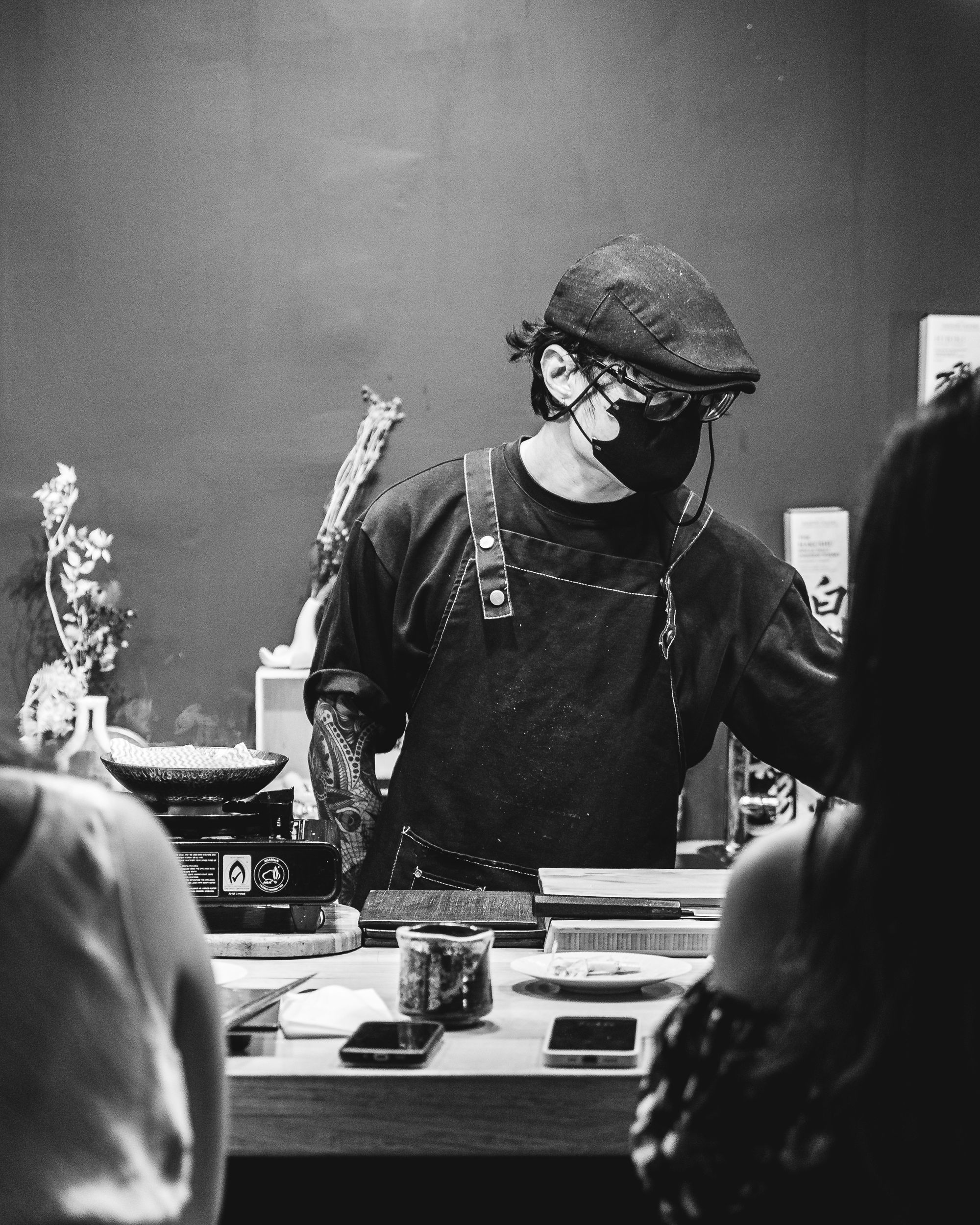 Close up of chef behind counter